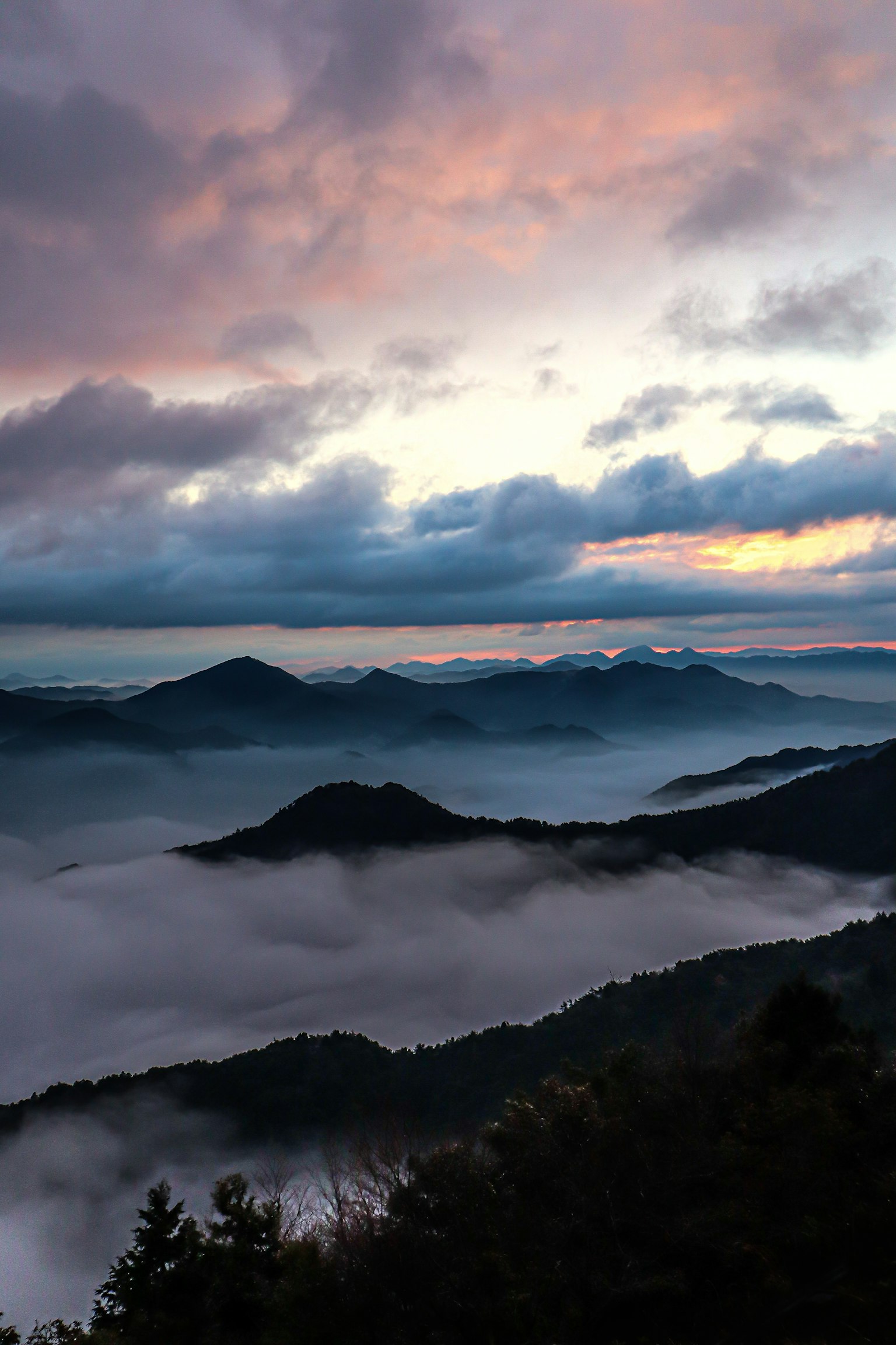 Mountain landscape with mist and a beautiful sunset