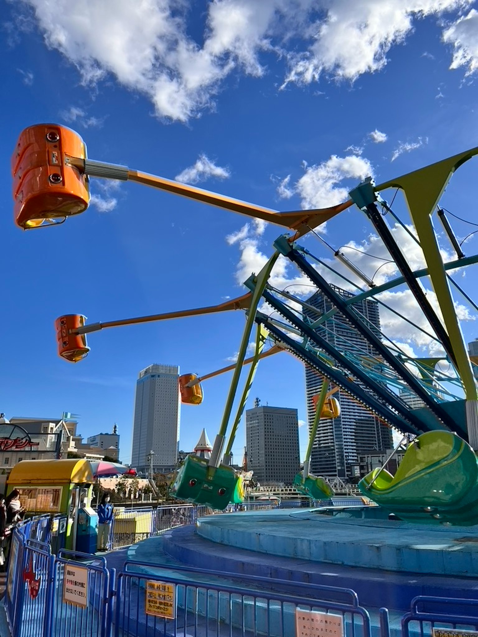 Colorful amusement park ride structure under a blue sky