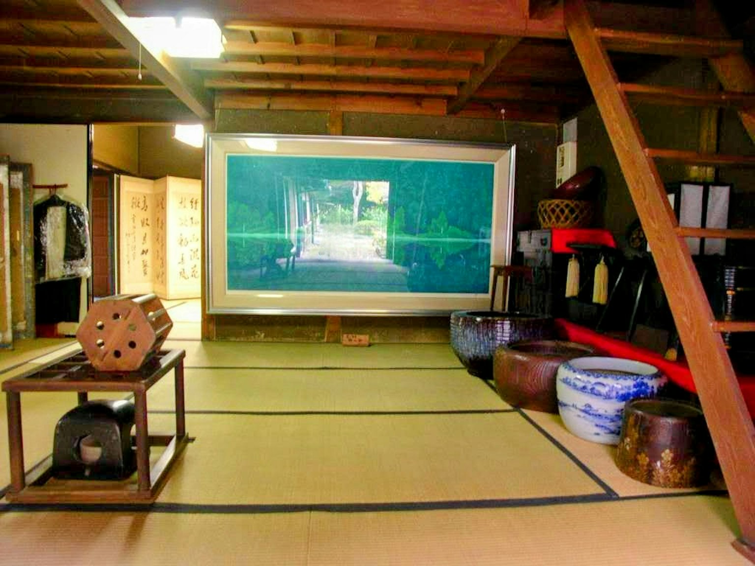 Traditional room featuring large screen and traditional furniture
