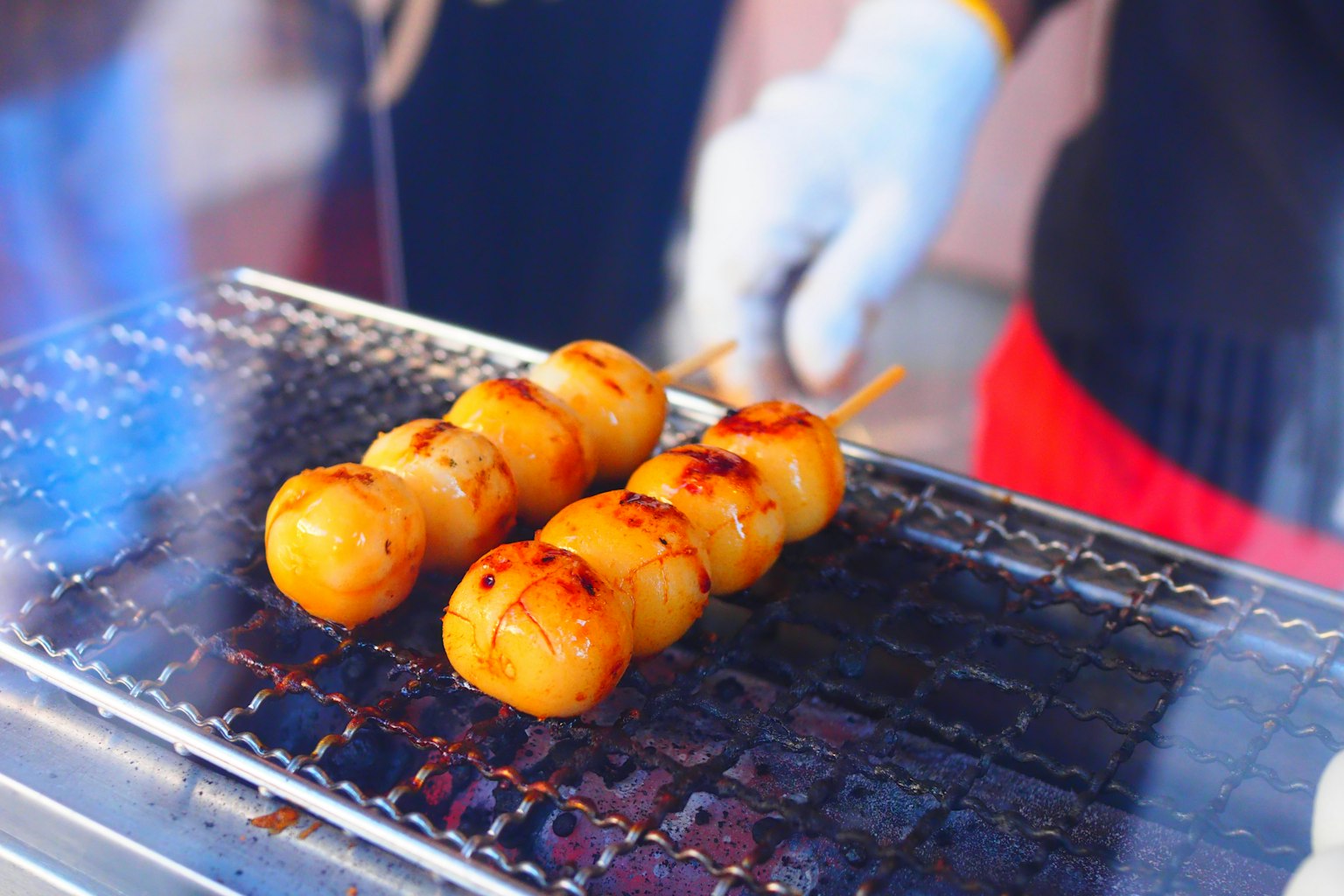Grilled dango skewers being prepared