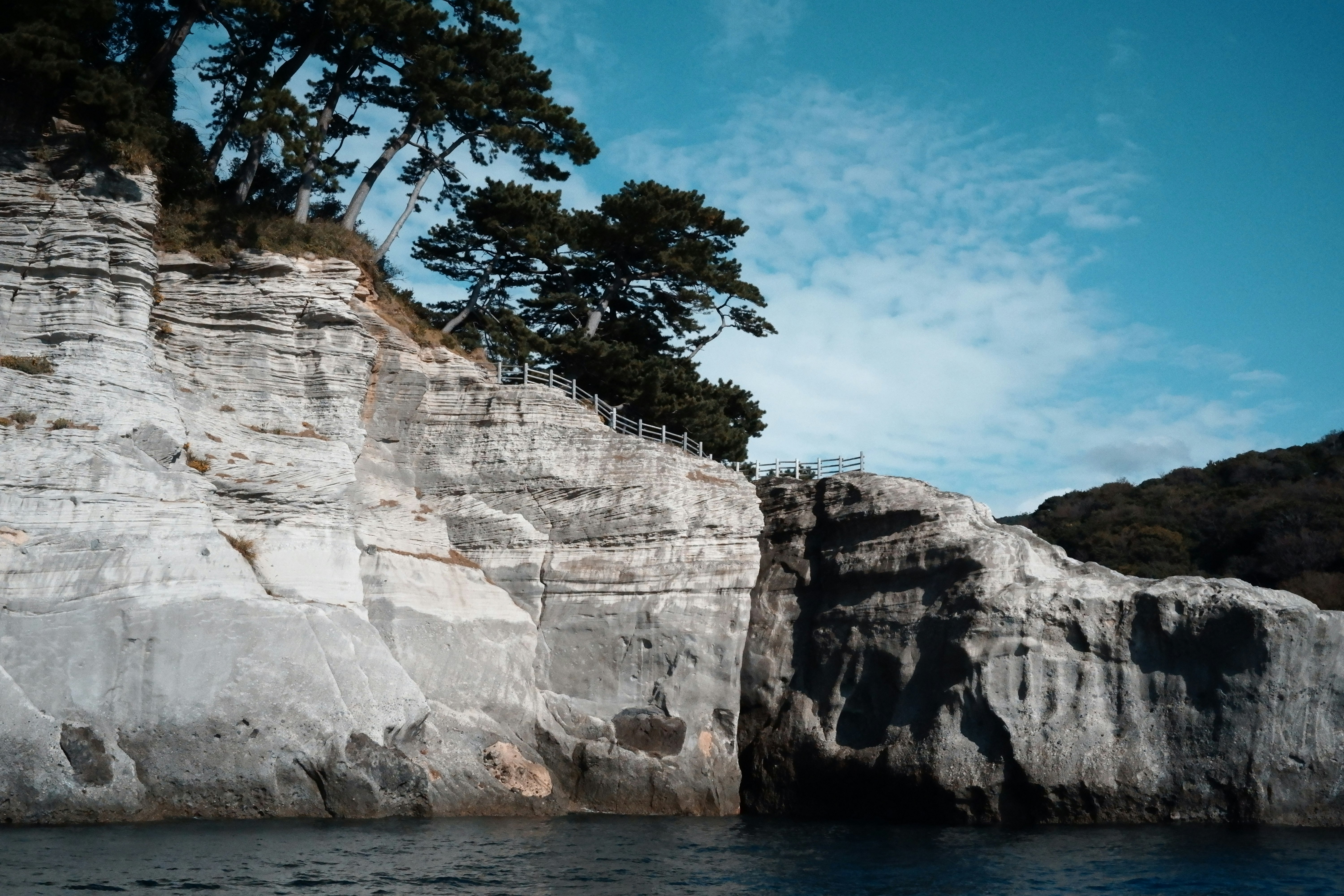 coastal landscape with white cliffs and a cove