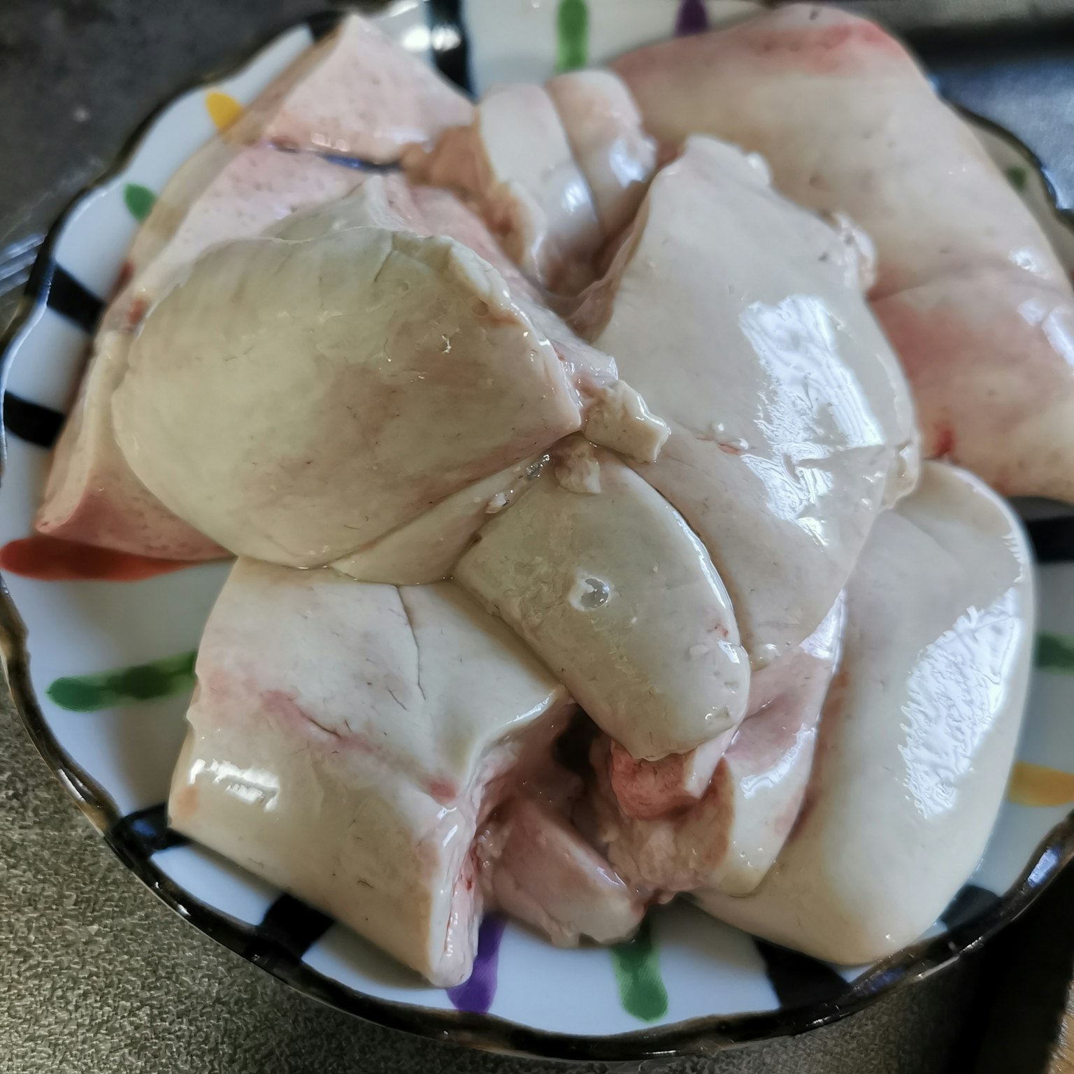 Plate of fresh sliced pork liver