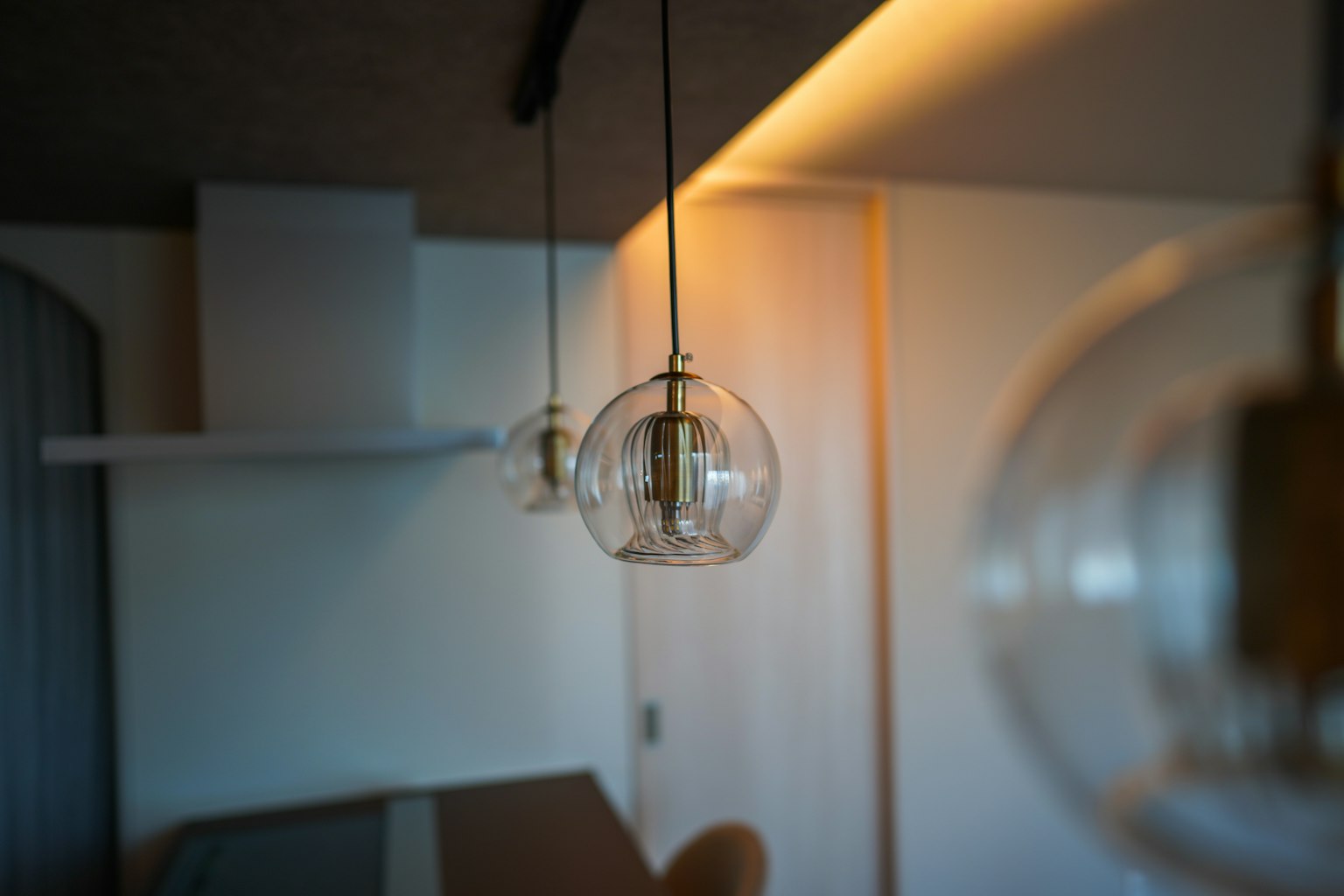 Modern interior with transparent glass pendant lights hanging