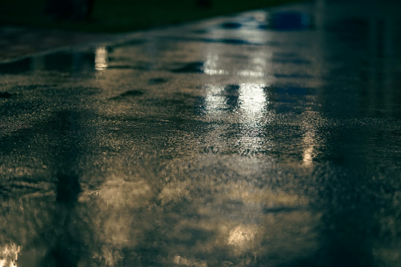 Reflective wet surface with light patterns