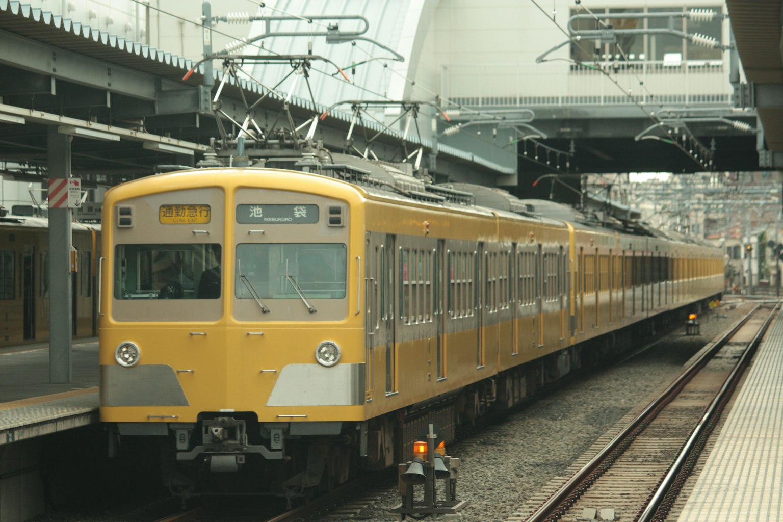 Yellow train stopped at a station