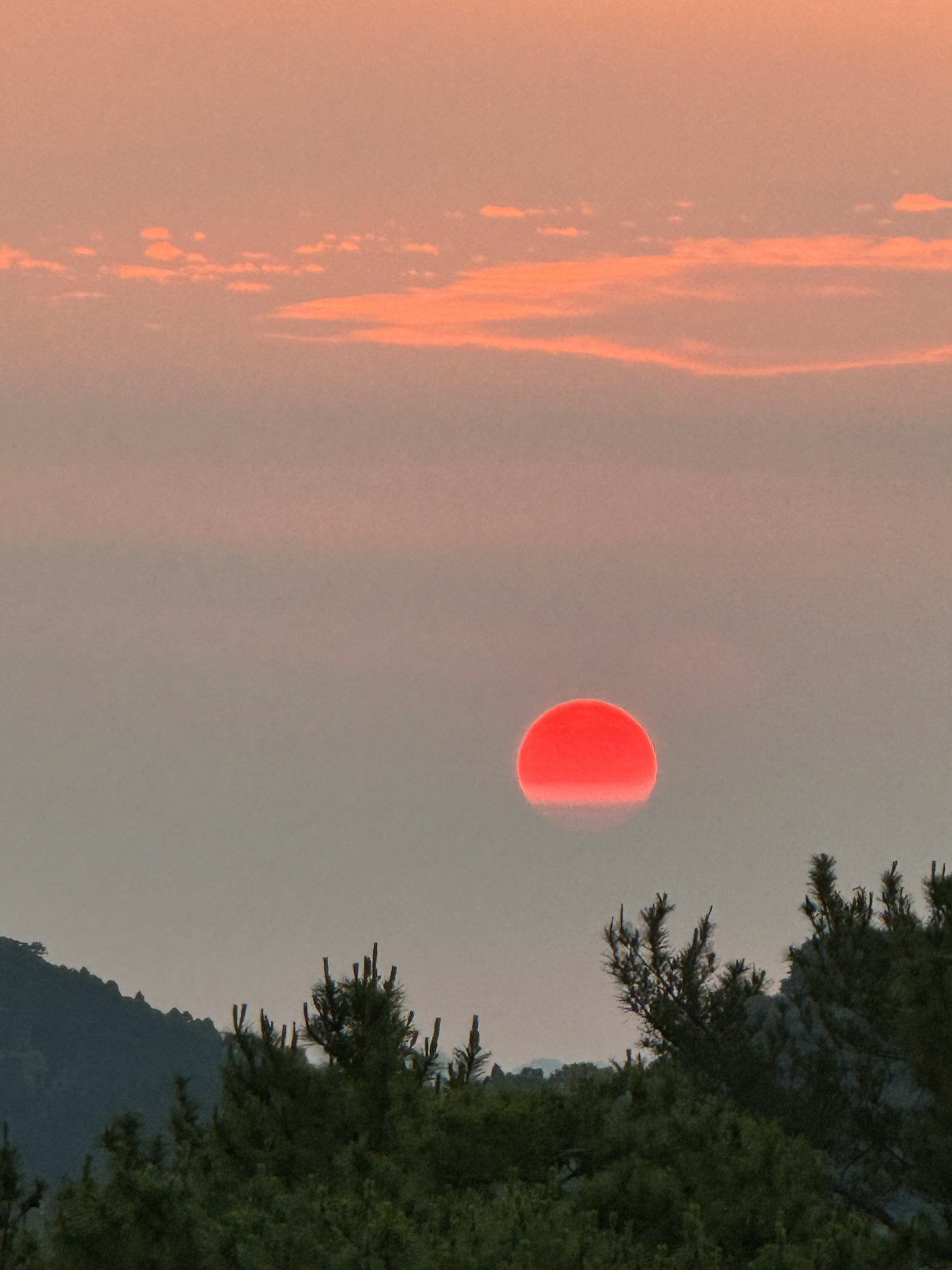 Beautiful landscape of the sun setting behind the mountains