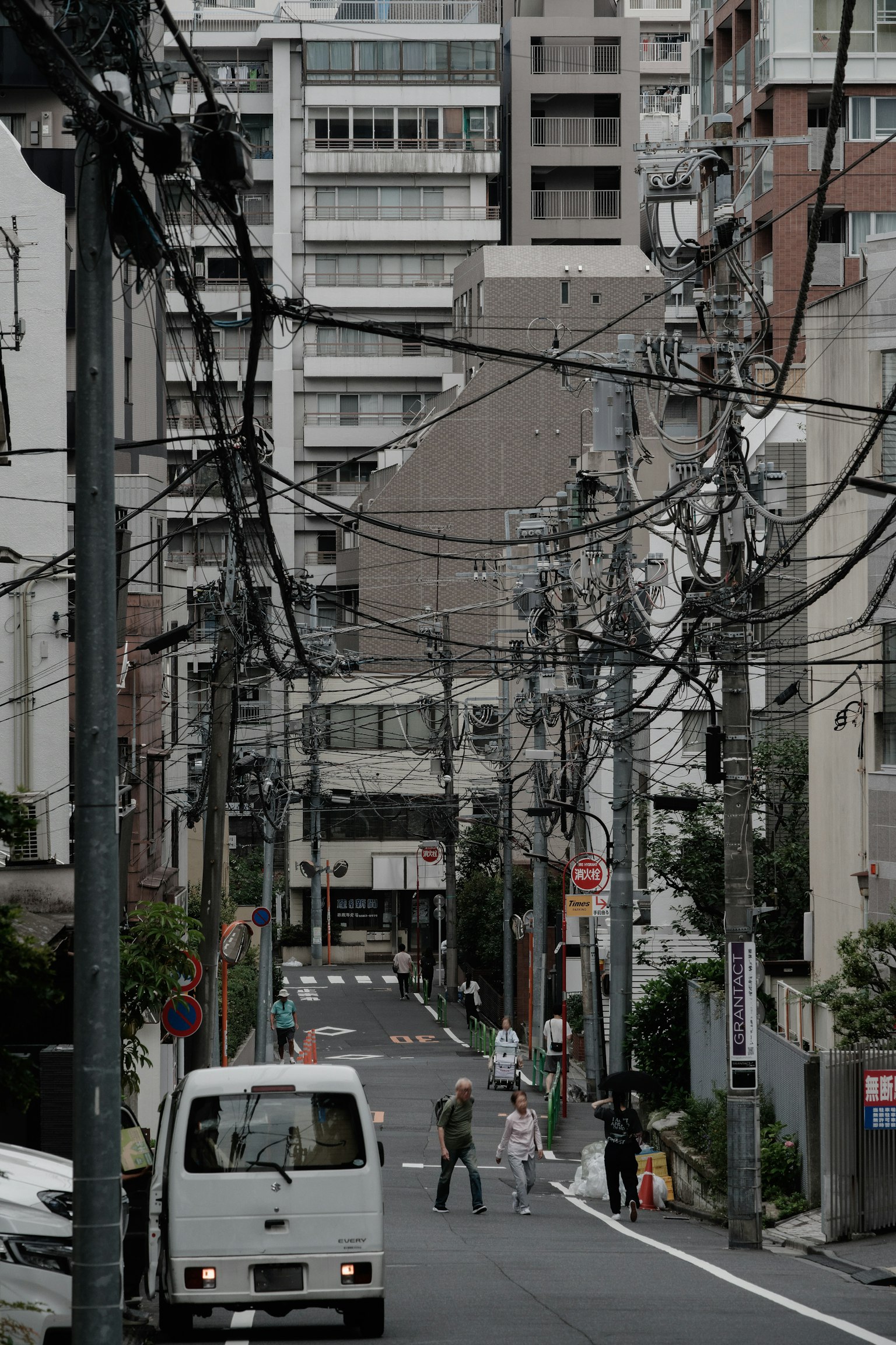Urban street view with power lines and buildings