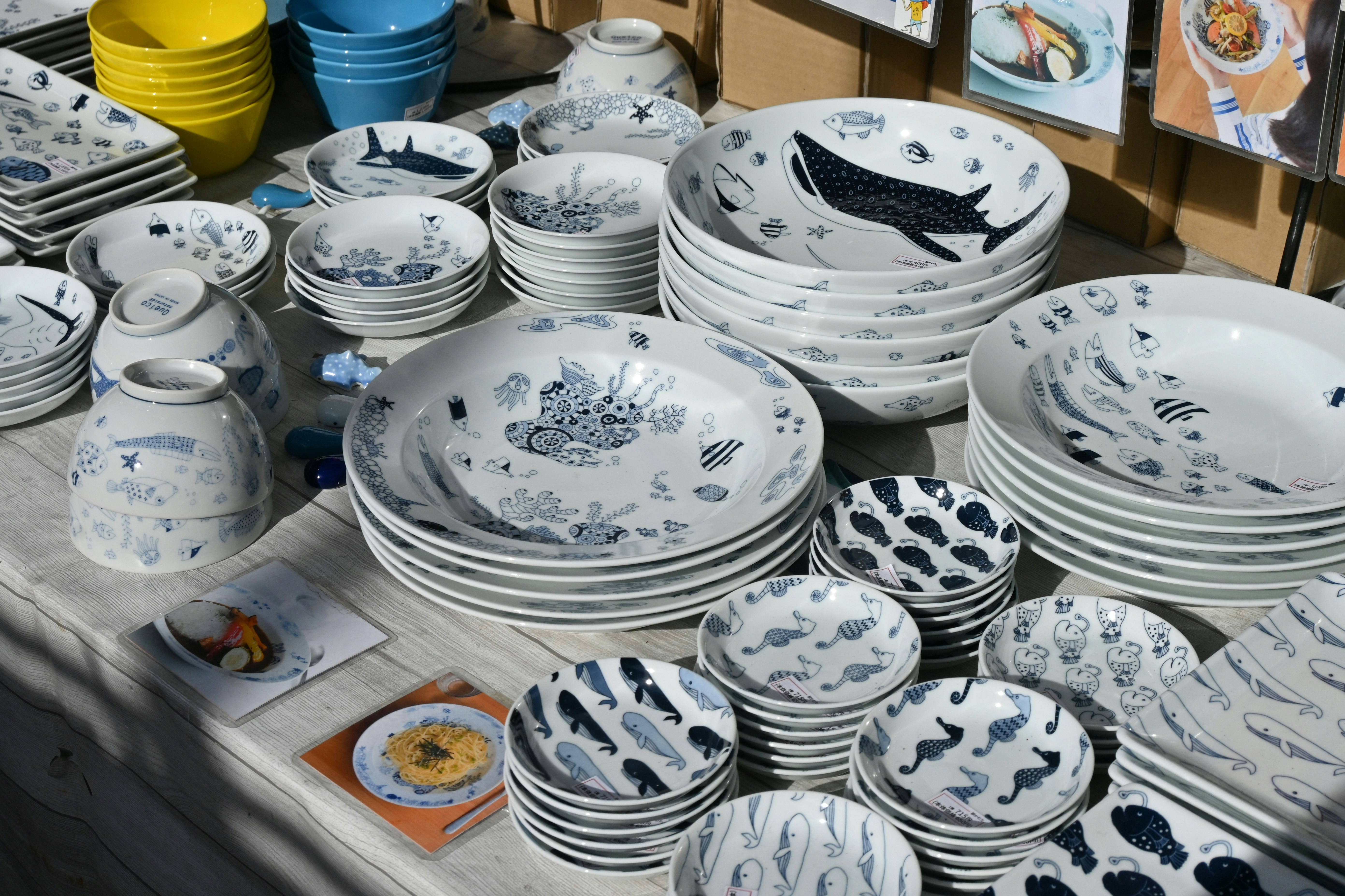 table display of blue patterned dinnerware