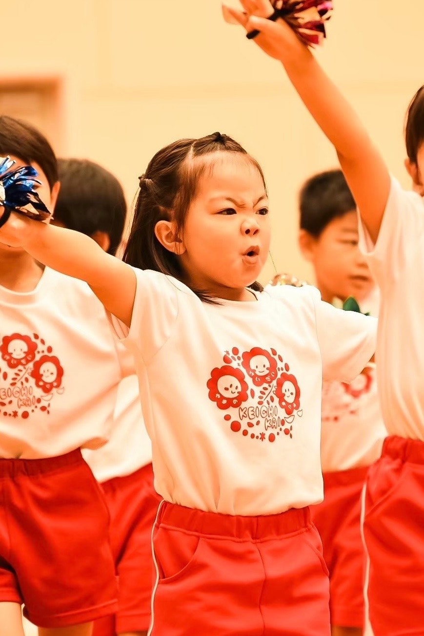 children in sportswear dancing in a classroom