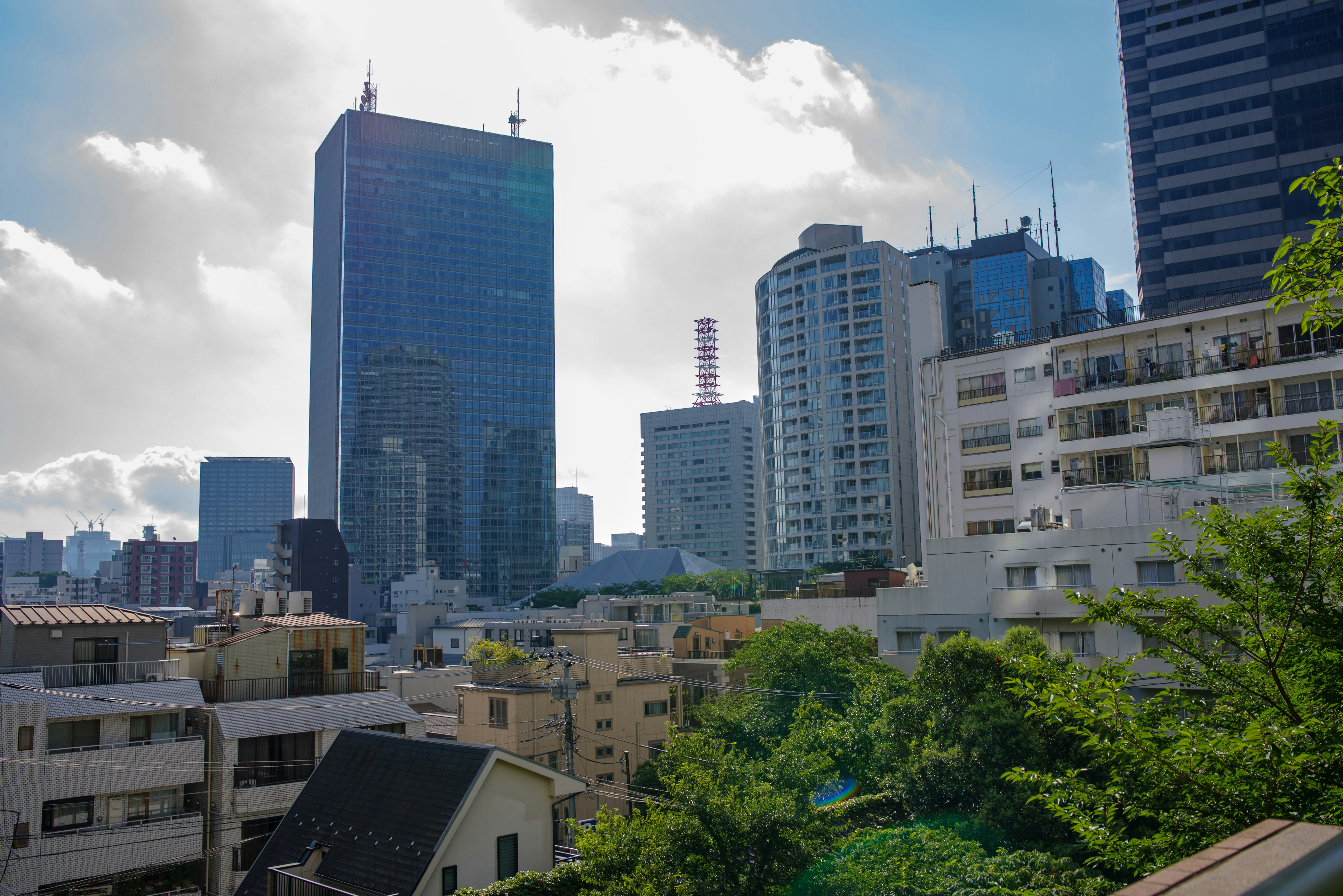 city skyline with tall office buildings under a blue sky