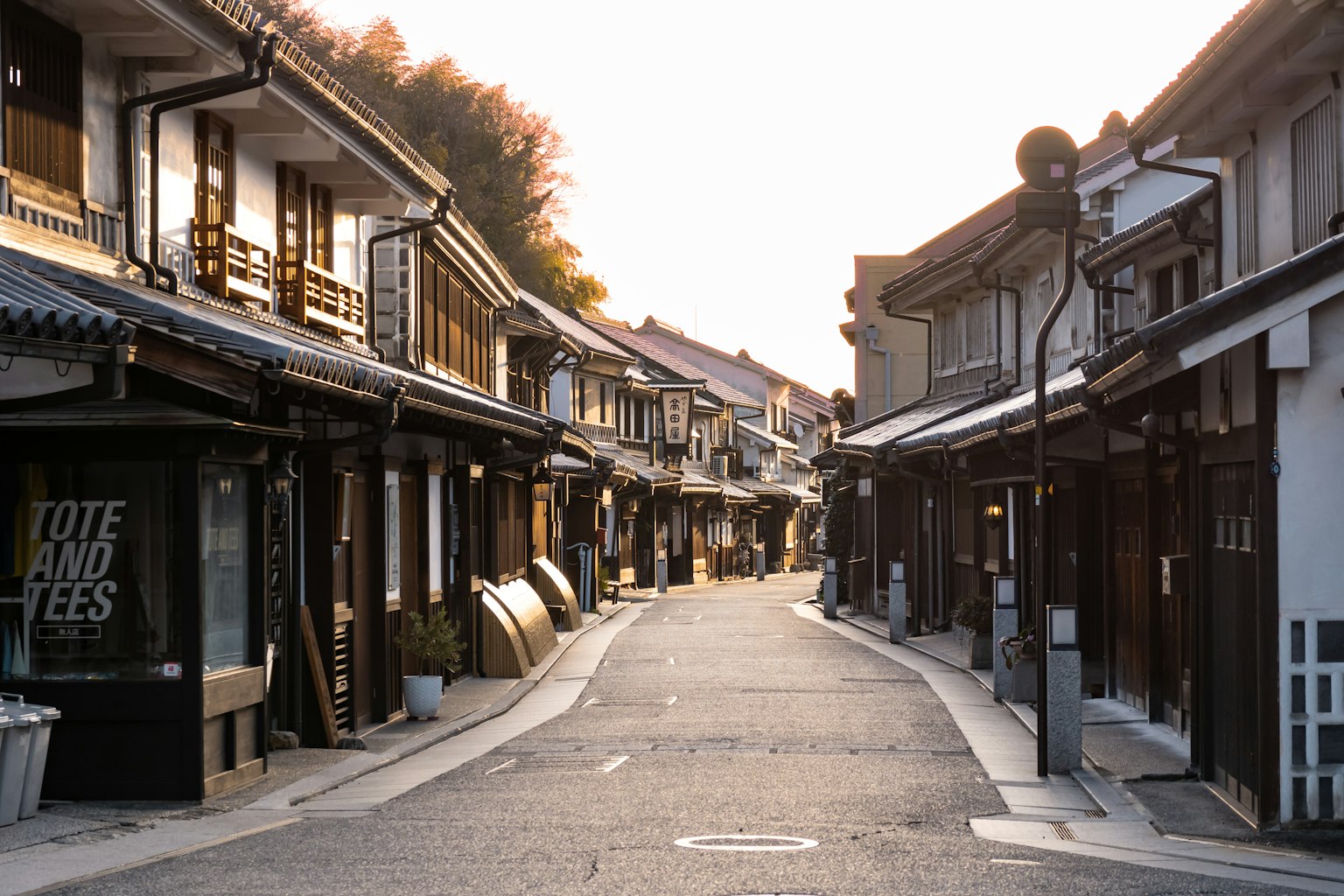 Quiet street of old Japanese buildings with soft evening light