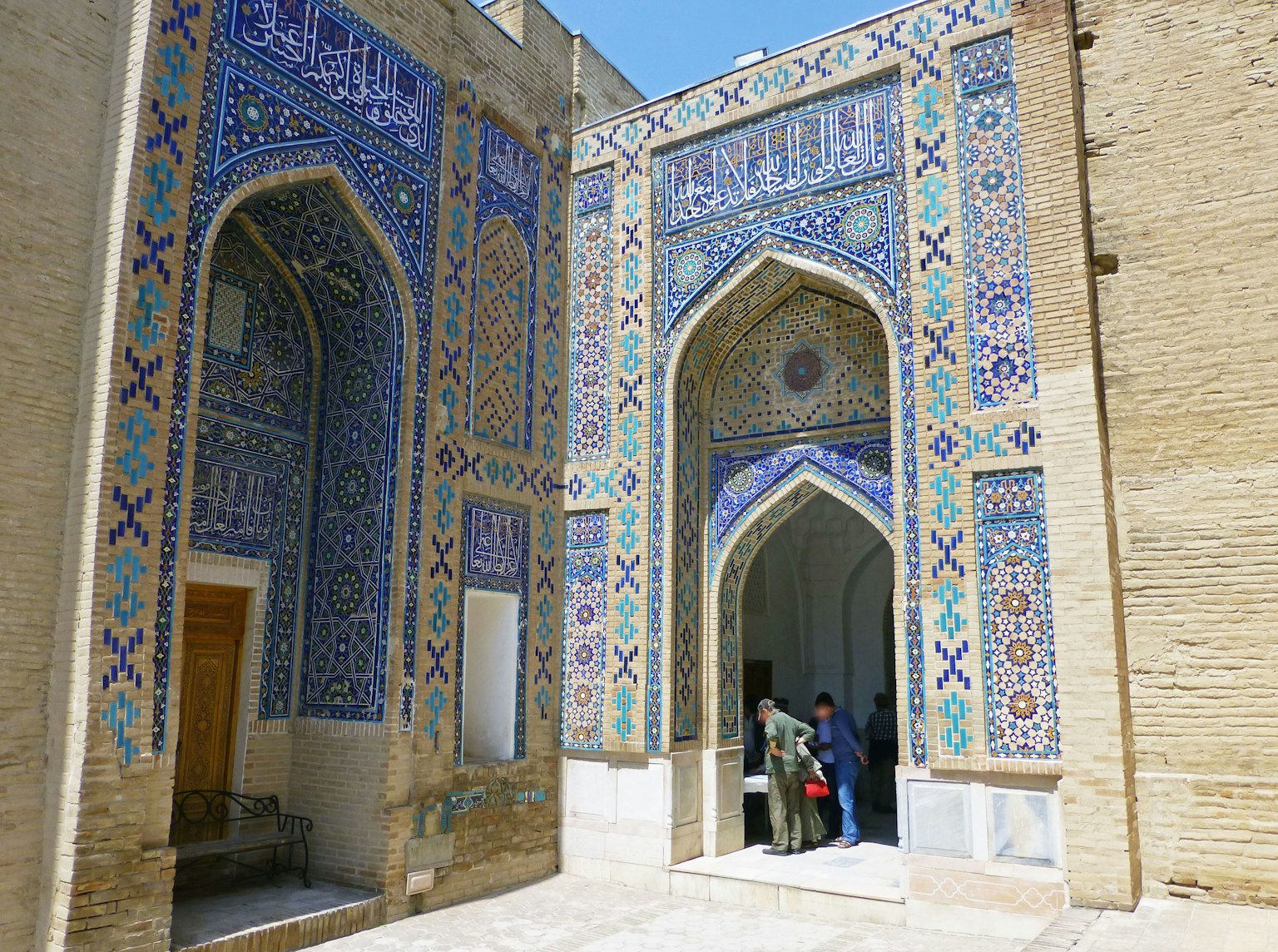 Historic courtyard with beautiful tiled archways and intricate patterns