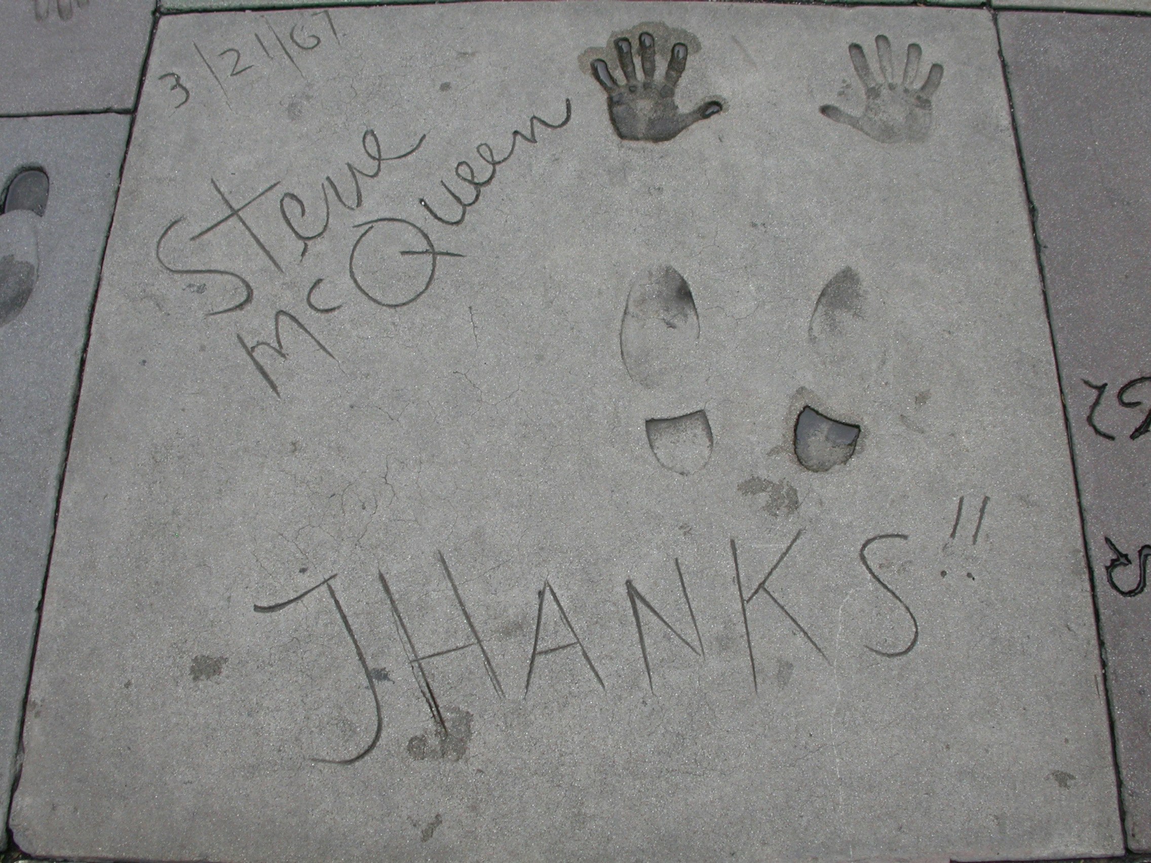 concrete floor with handwritten messages and graffiti
