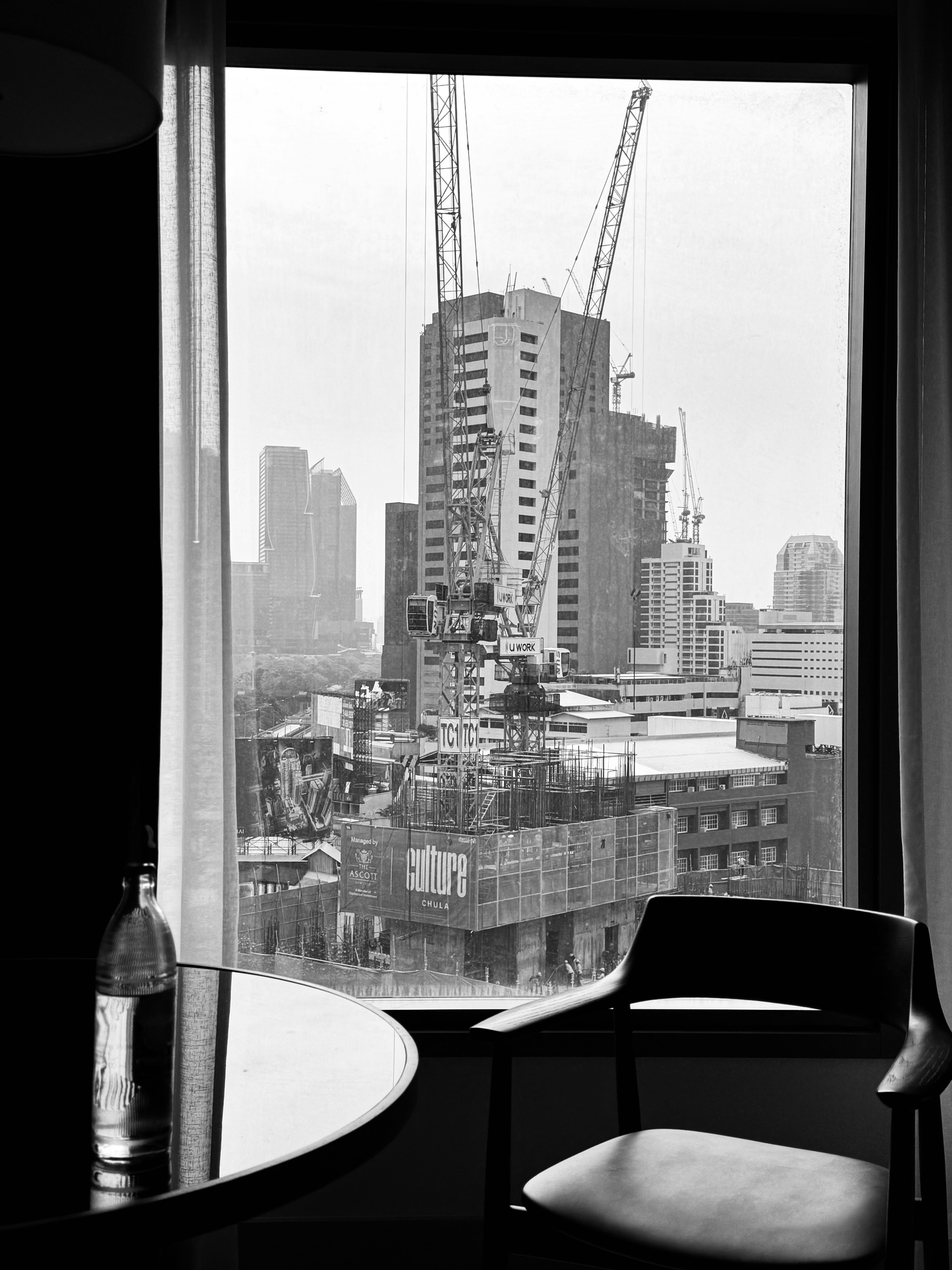 urban skyline with a construction site seen from a window