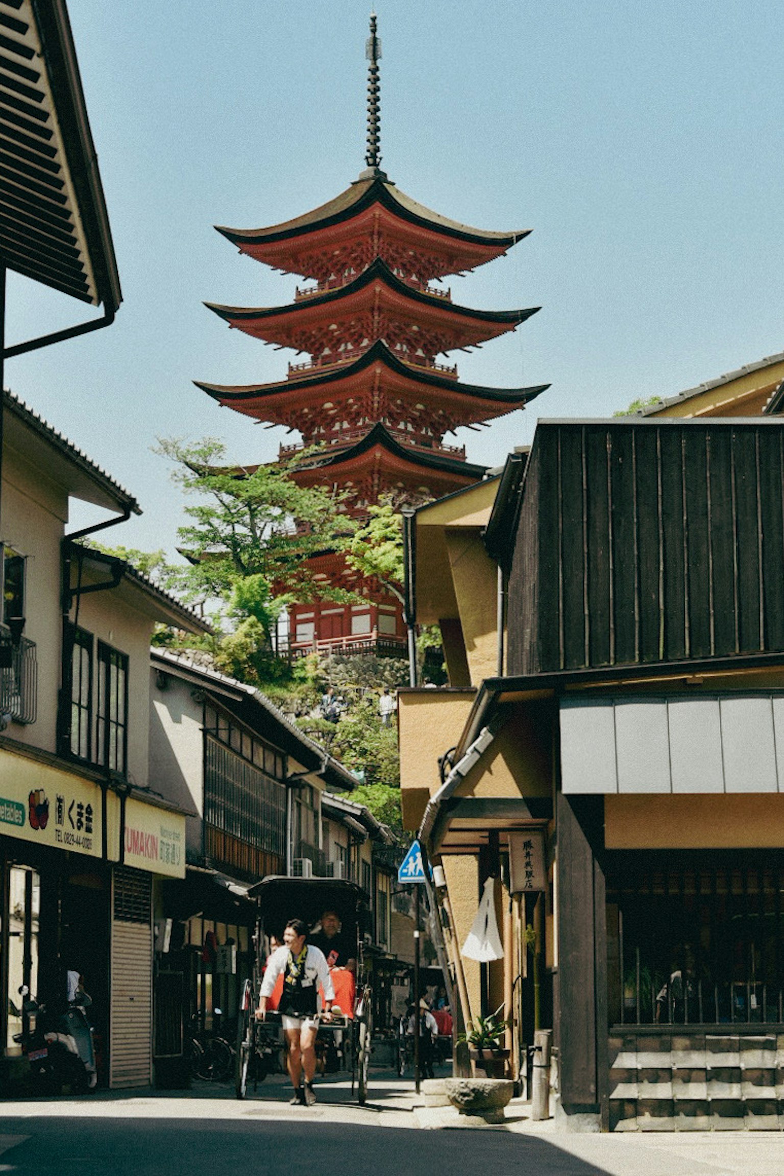 Traditional Japanese street featuring a pagoda and historic buildings