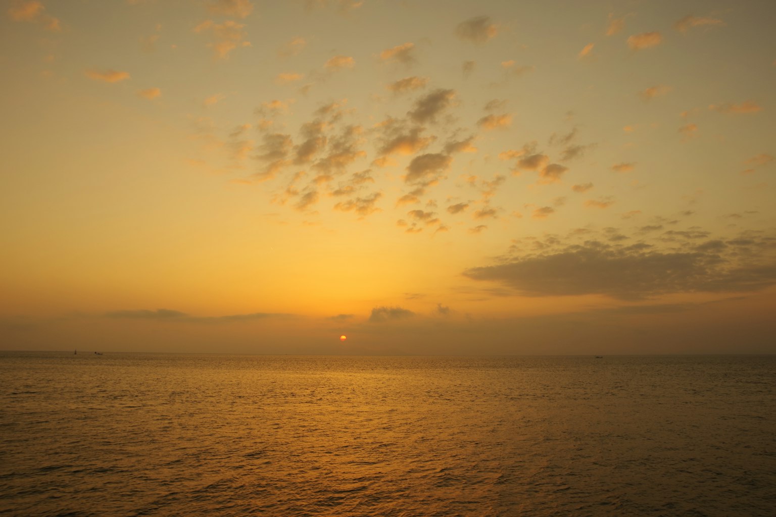 Beautiful sunset over the ocean with clouds