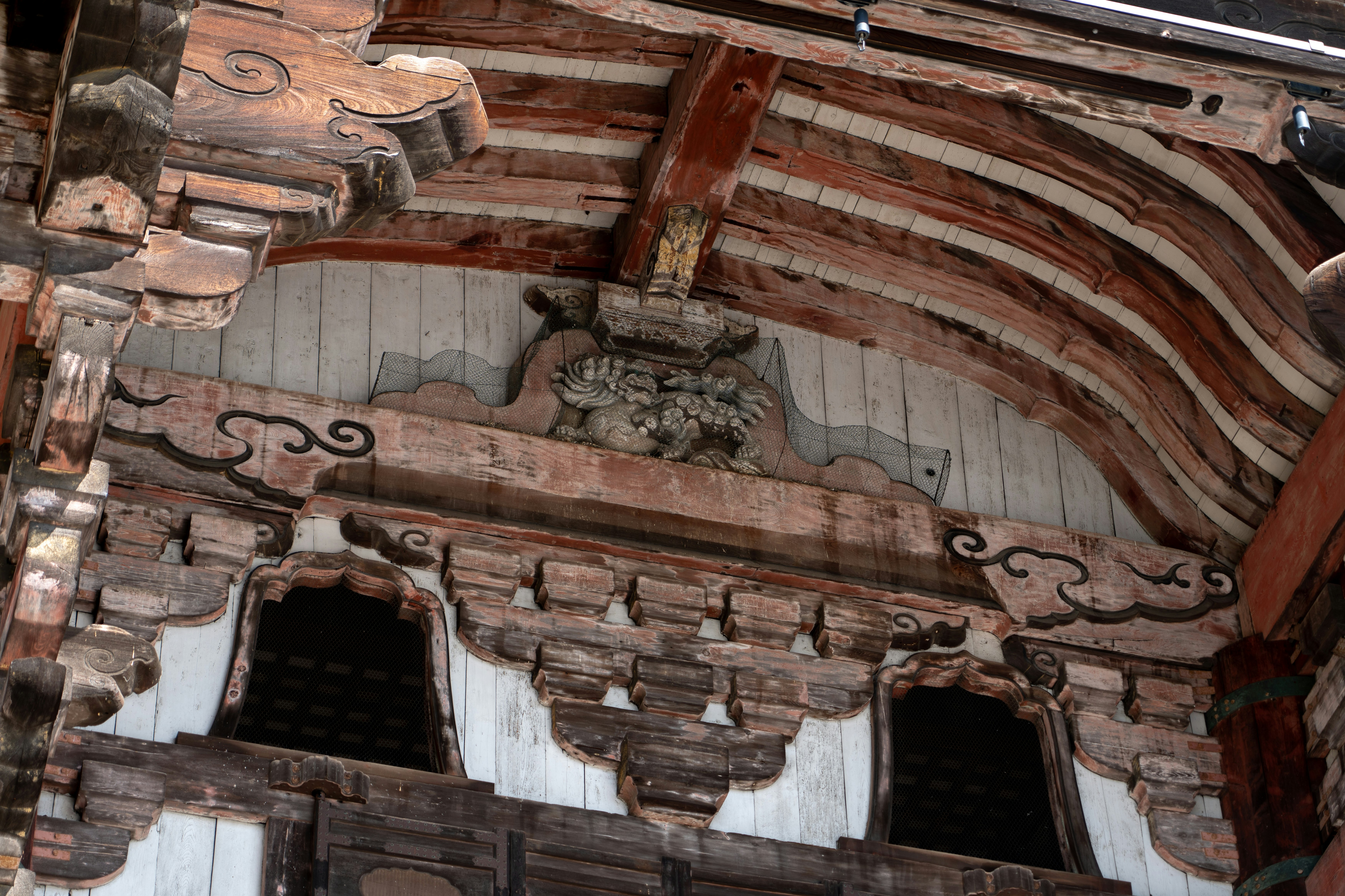 Decorative wooden carvings on the roof of a temple