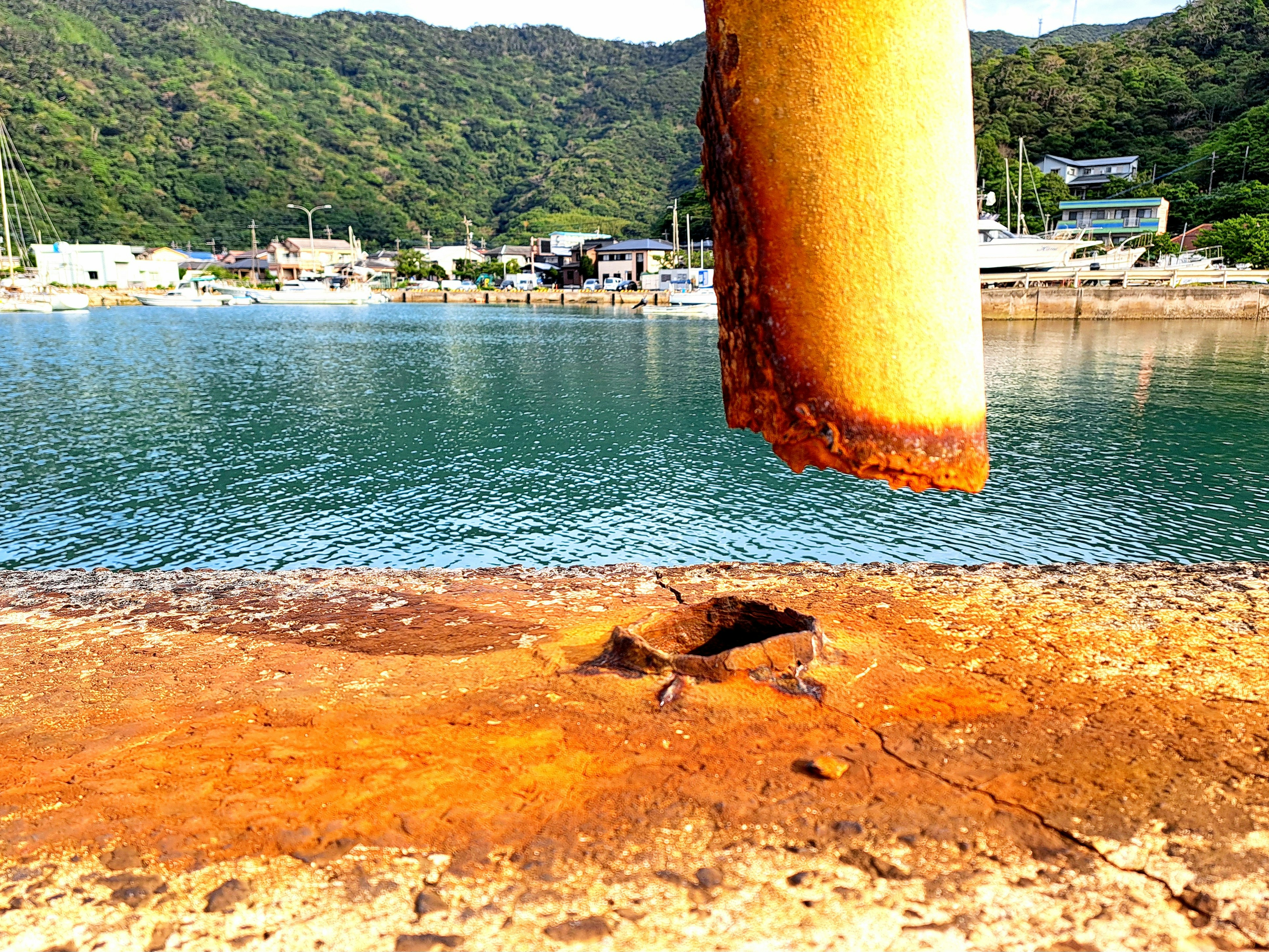 rusty guardrail by the seaside and the waterfront view