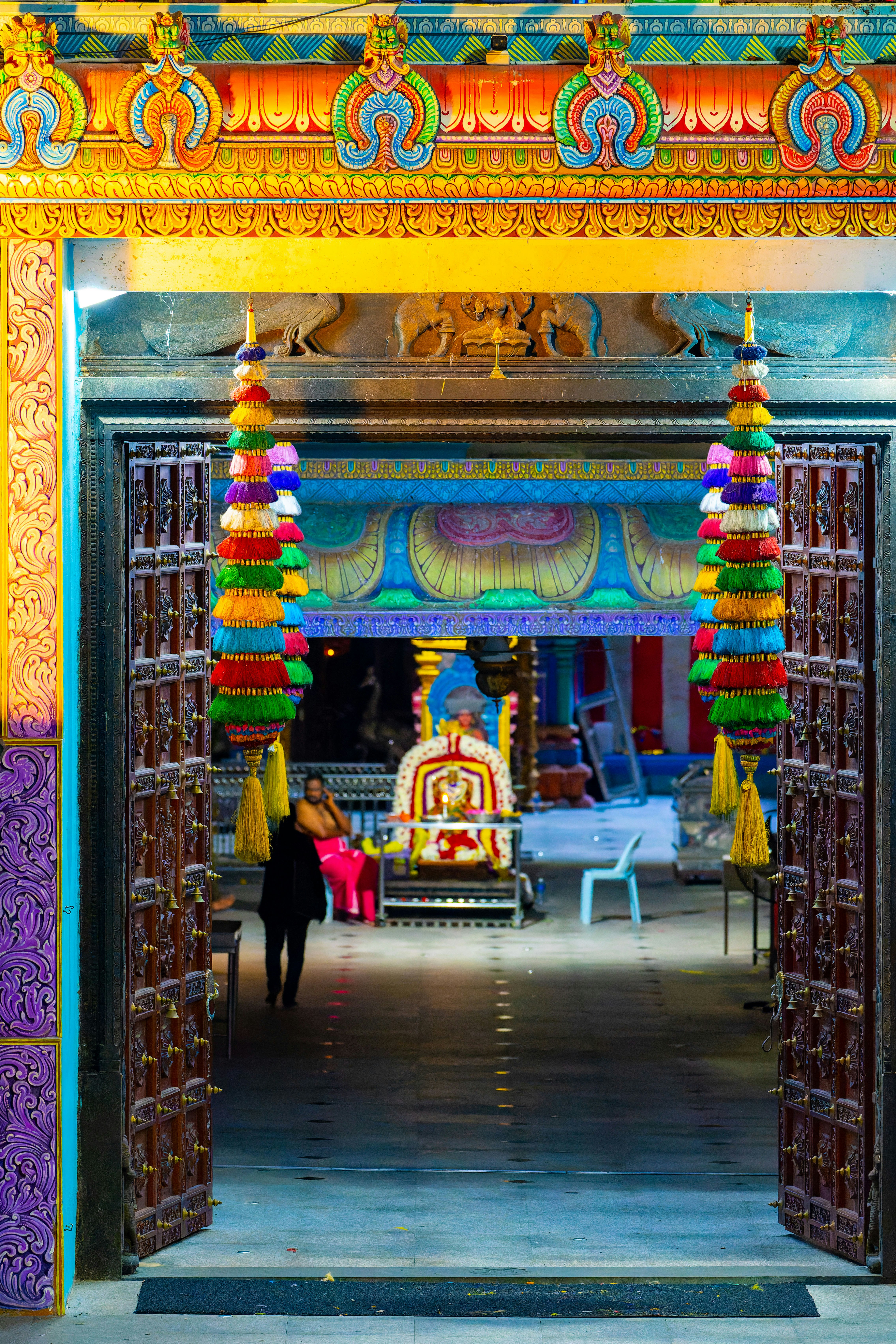 colorful decorated temple gateway leading to a shrine
