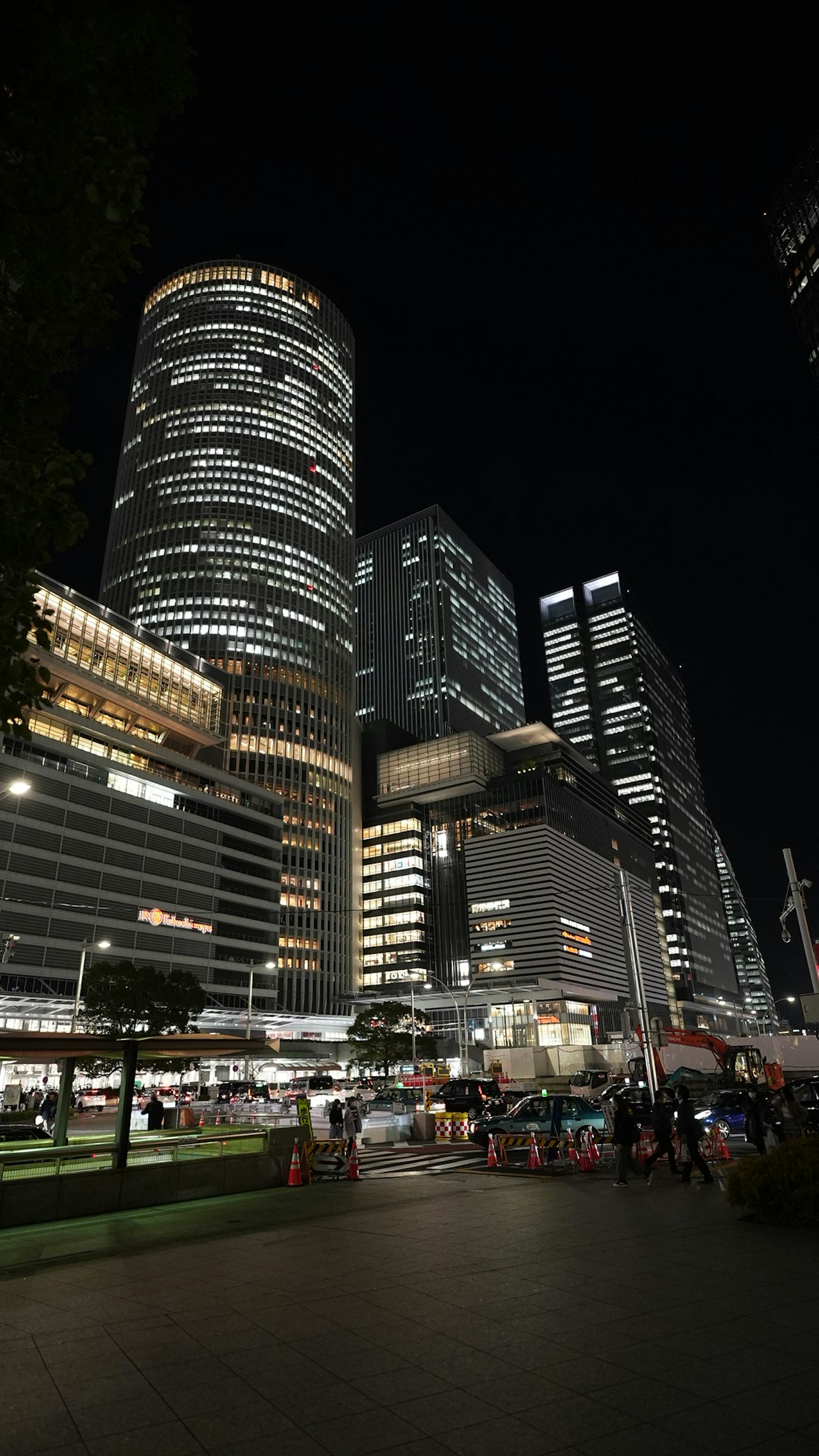 Night view of skyscrapers and bustling street scene