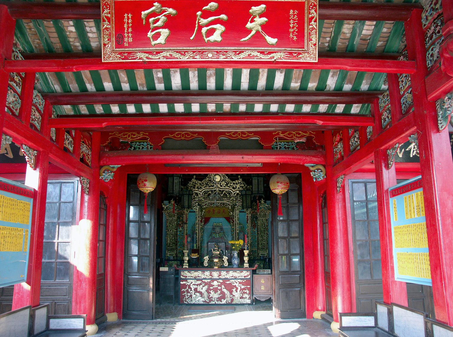 Interior decoration and altar of a temple with a red entrance