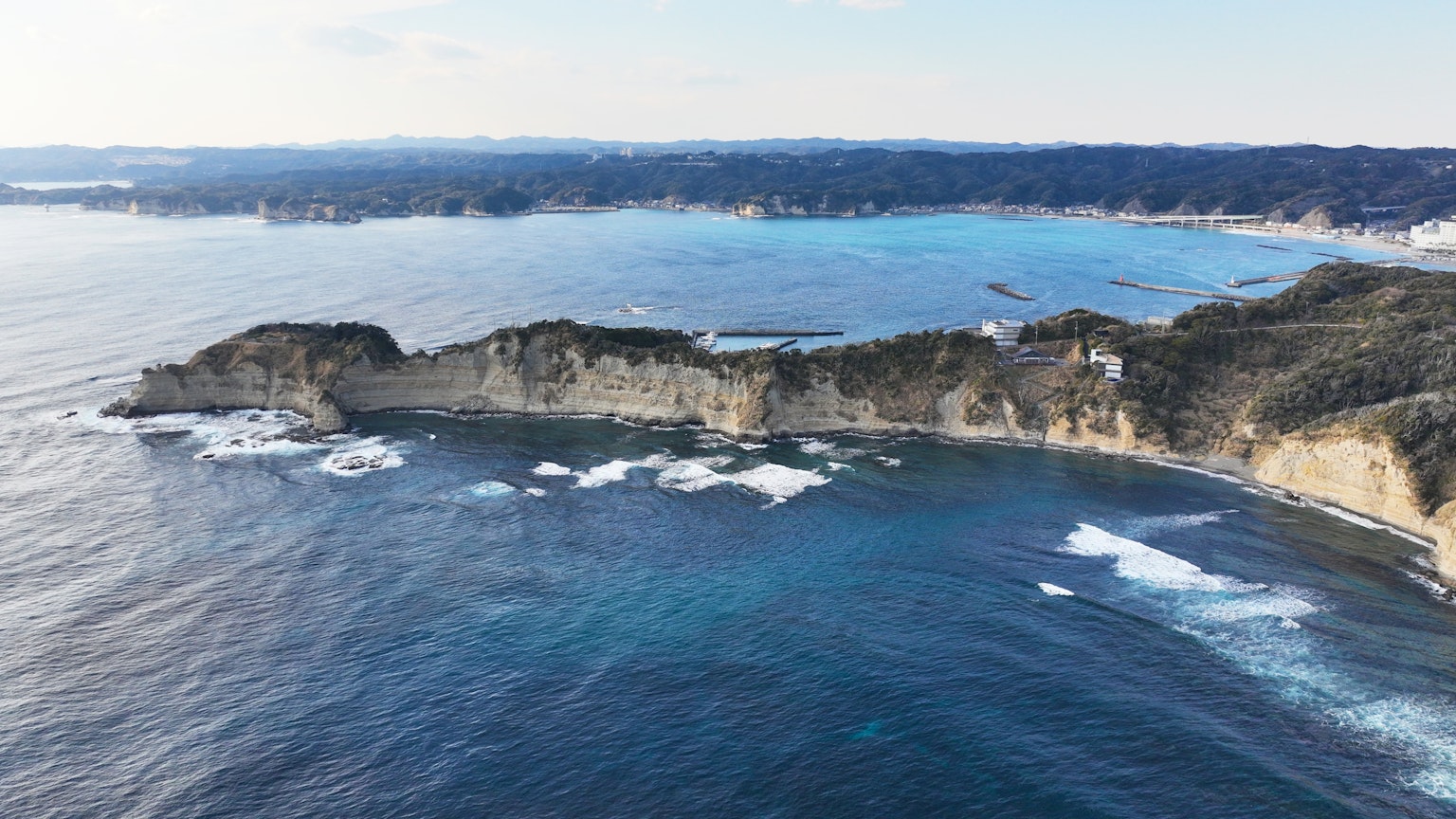 Scenic view of a coastline with cliffs and blue ocean