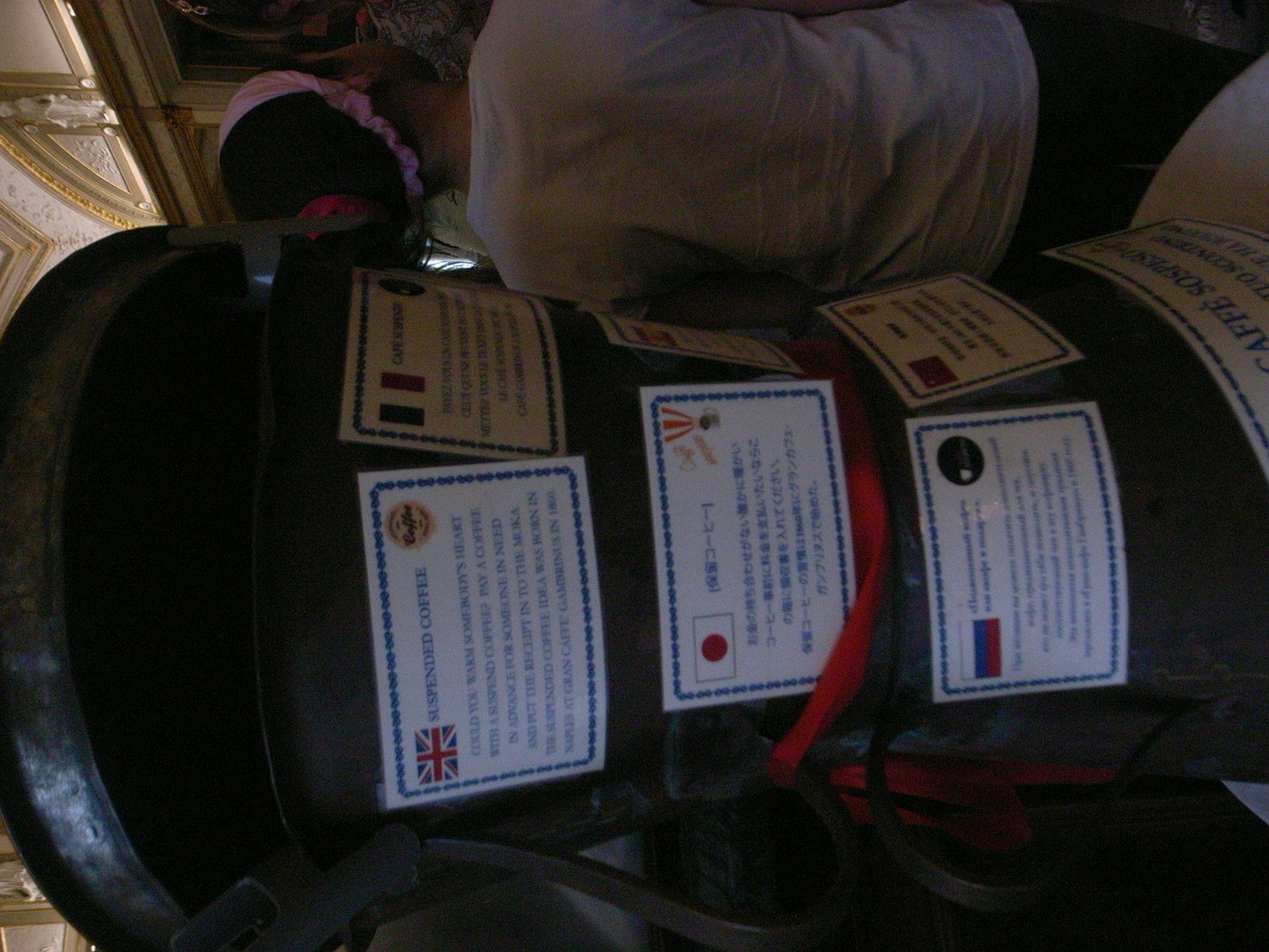 Image of a metal container with multiple labels attached