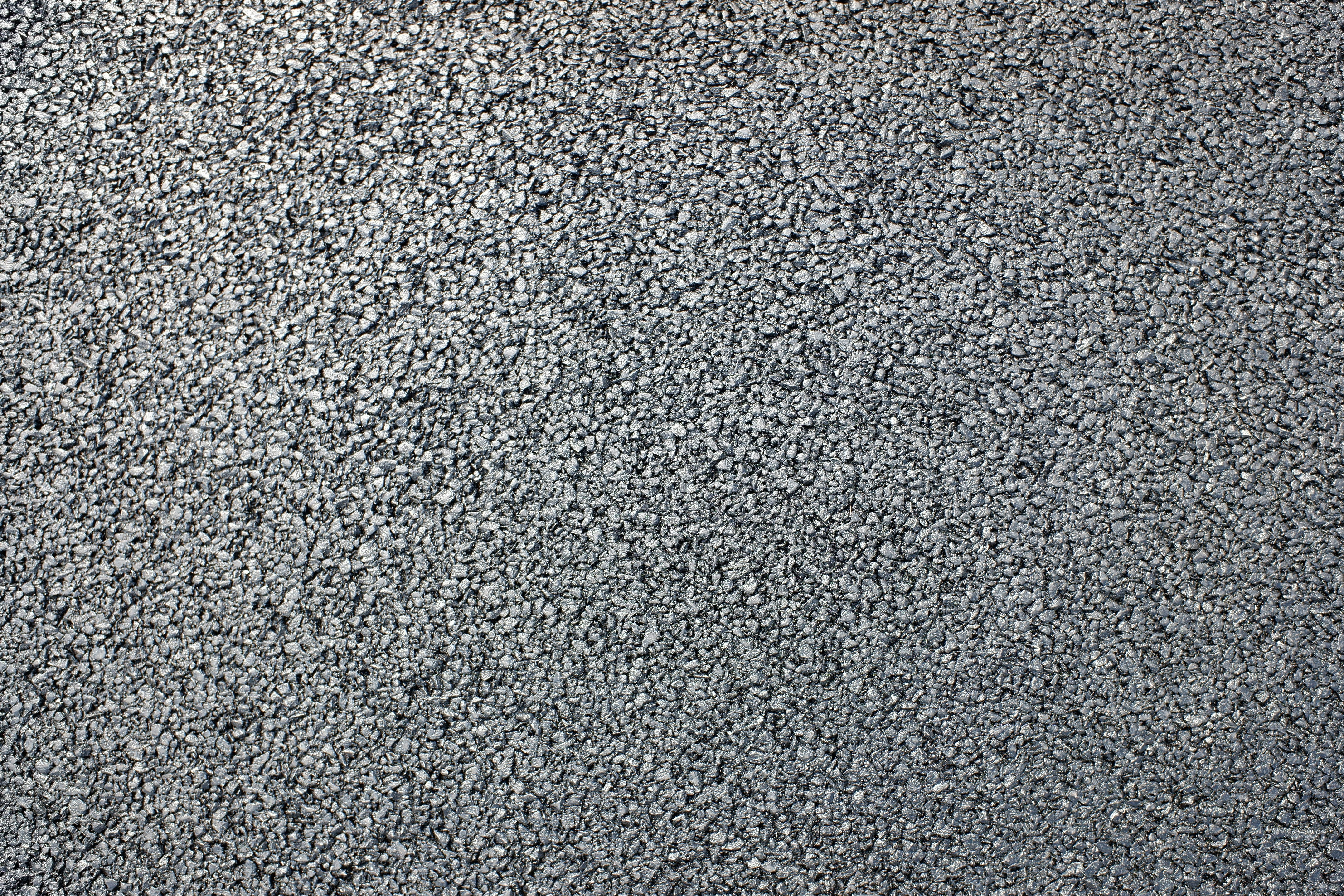 close-up of a paved surface covered with small gravel