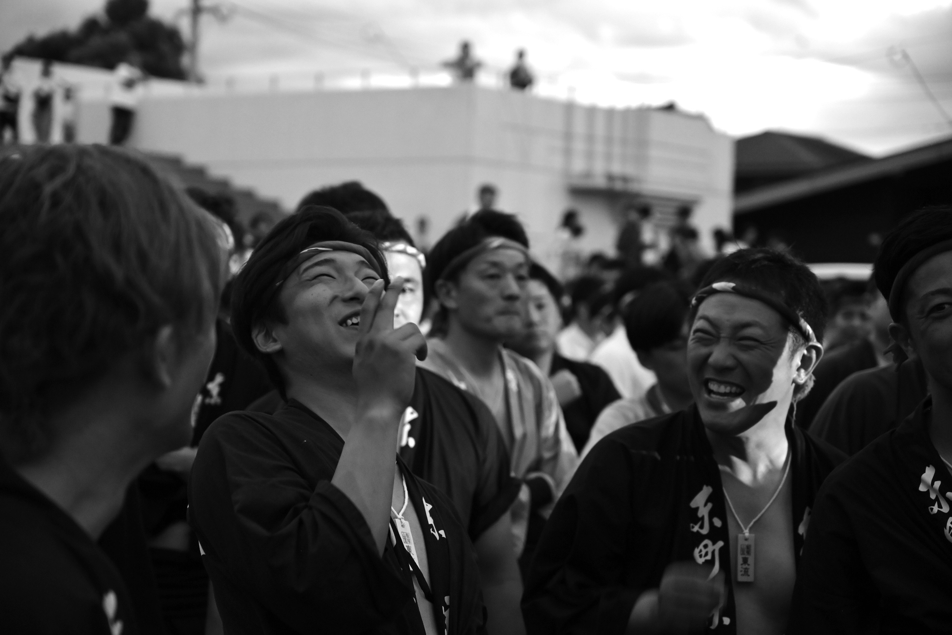 smiling crowd gathered outdoors