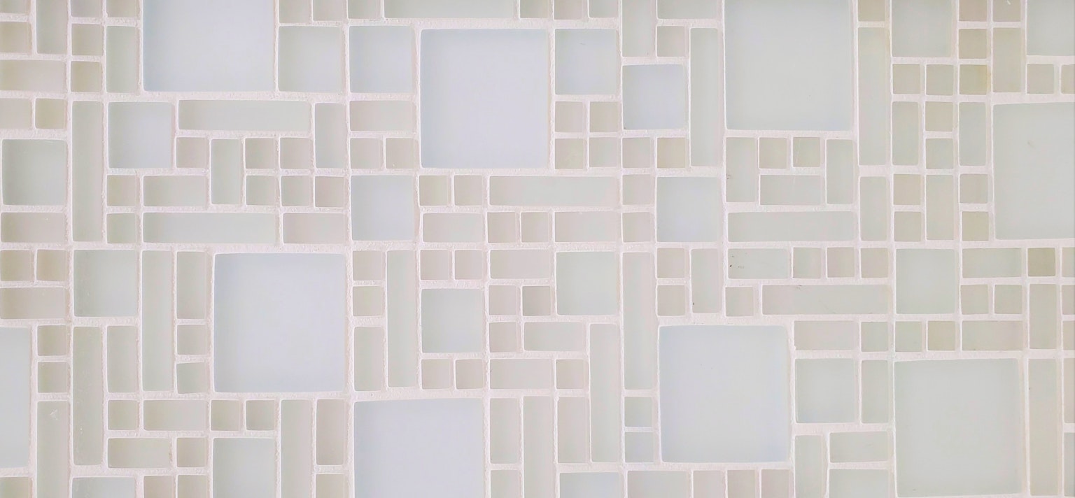 Geometric wall design in white and cream colors