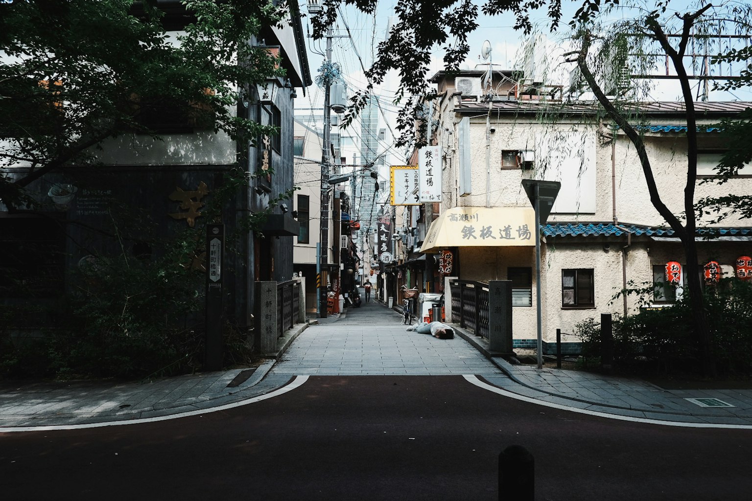 Quiet street corner scene with a mix of old buildings and modern elements