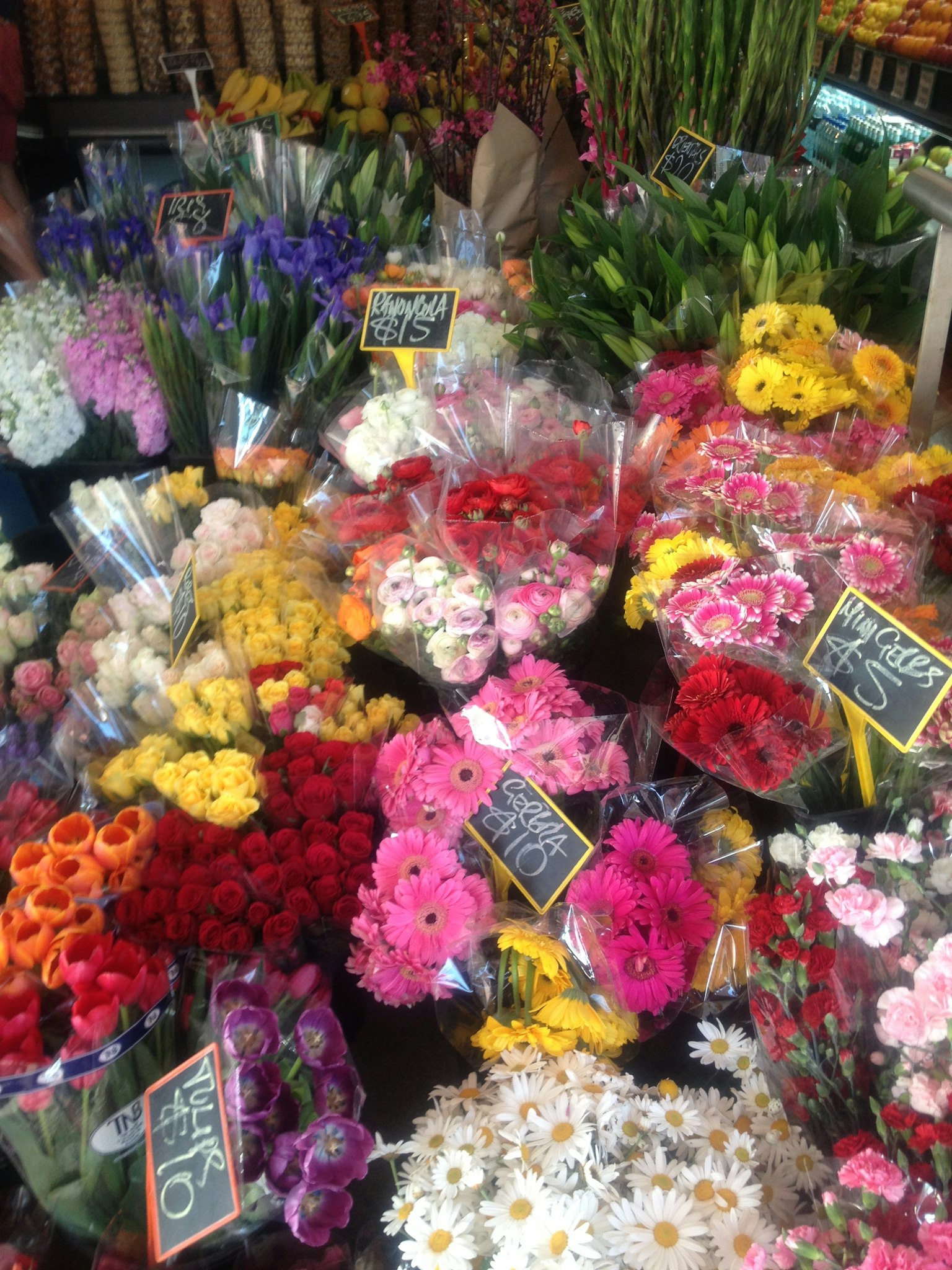 A vibrant flower market scene with various colorful bouquets