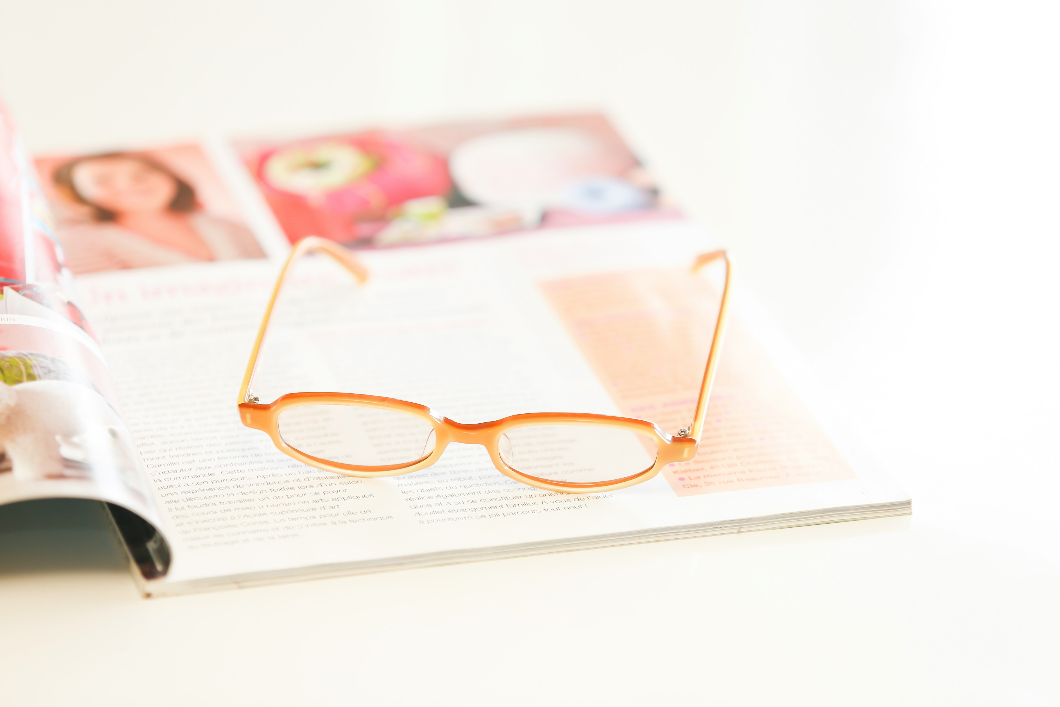 glasses resting on an open book
