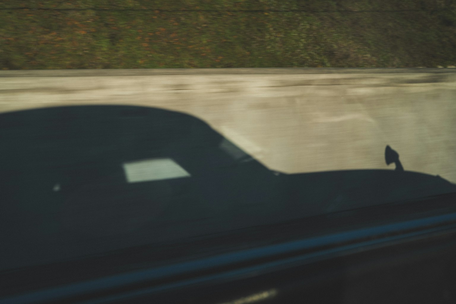 Shadow of a car on the road