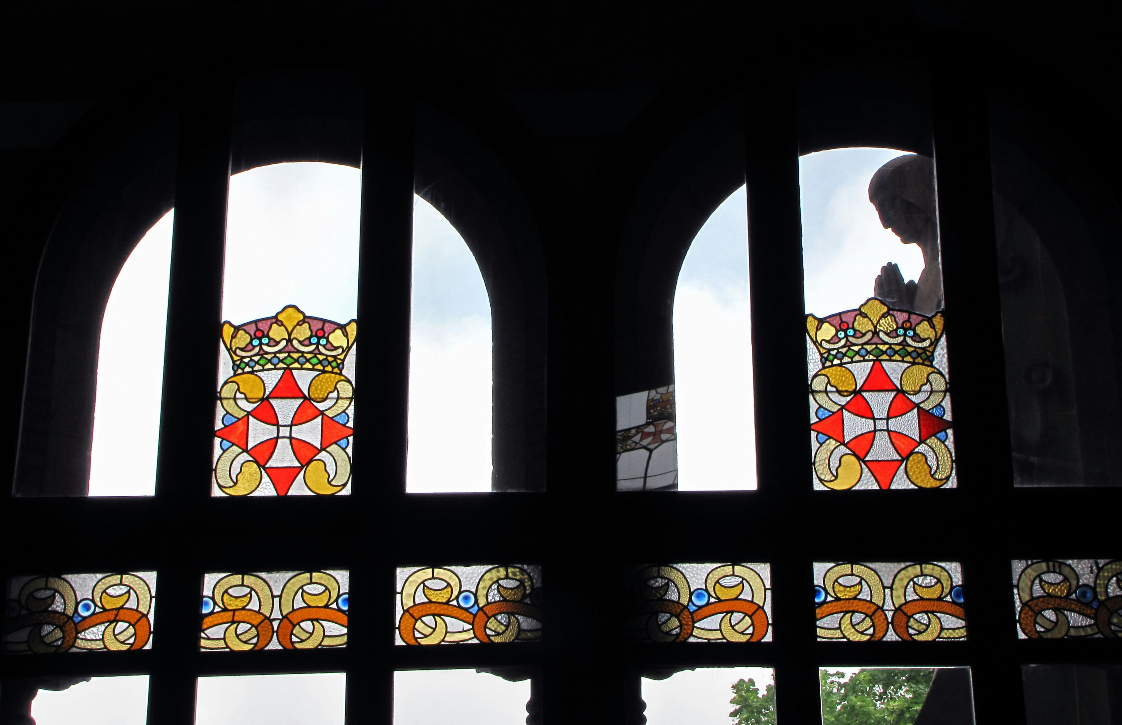 stained glass window with arched architecture