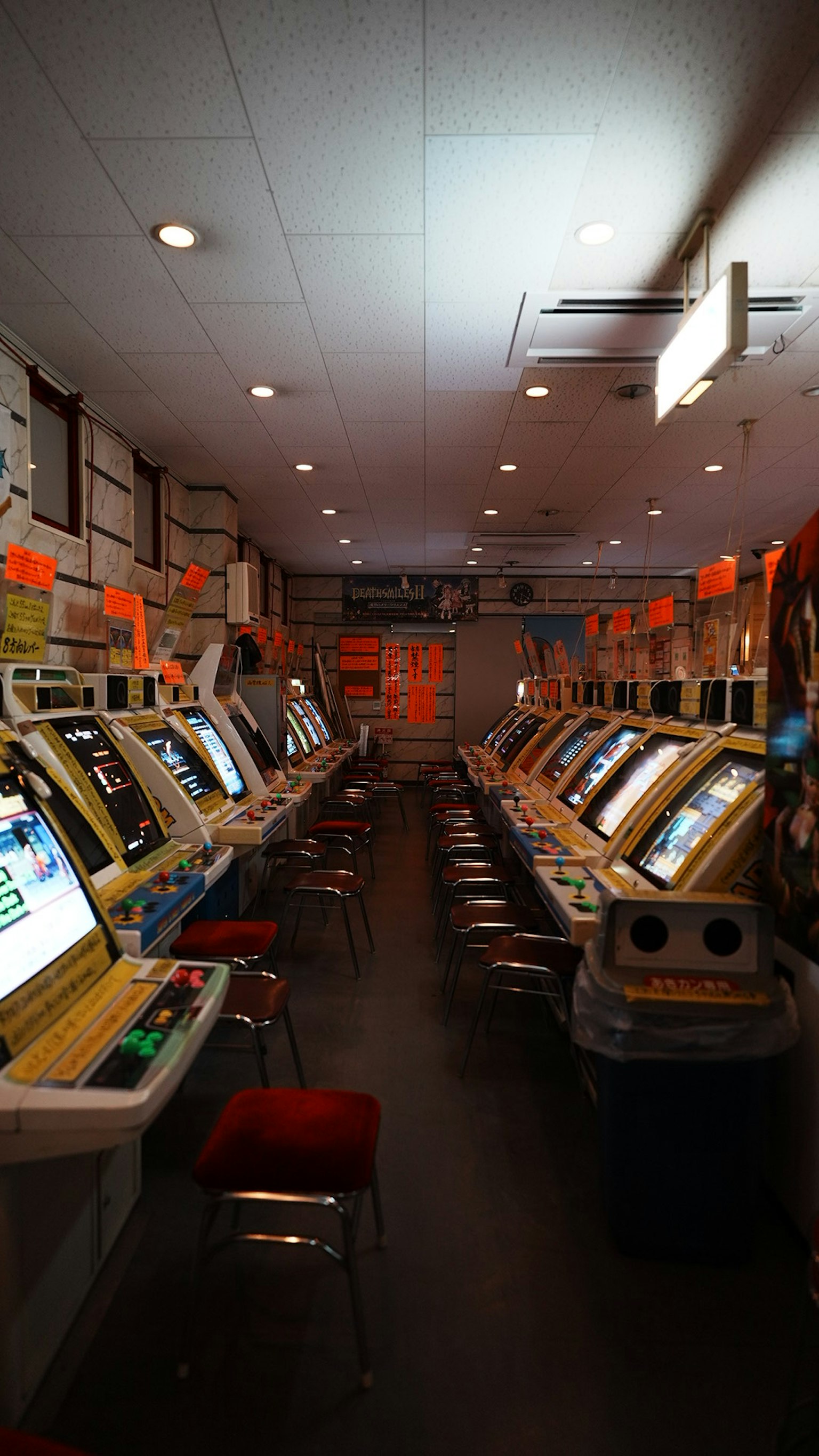 Interior of a gaming room with rows of slot machines