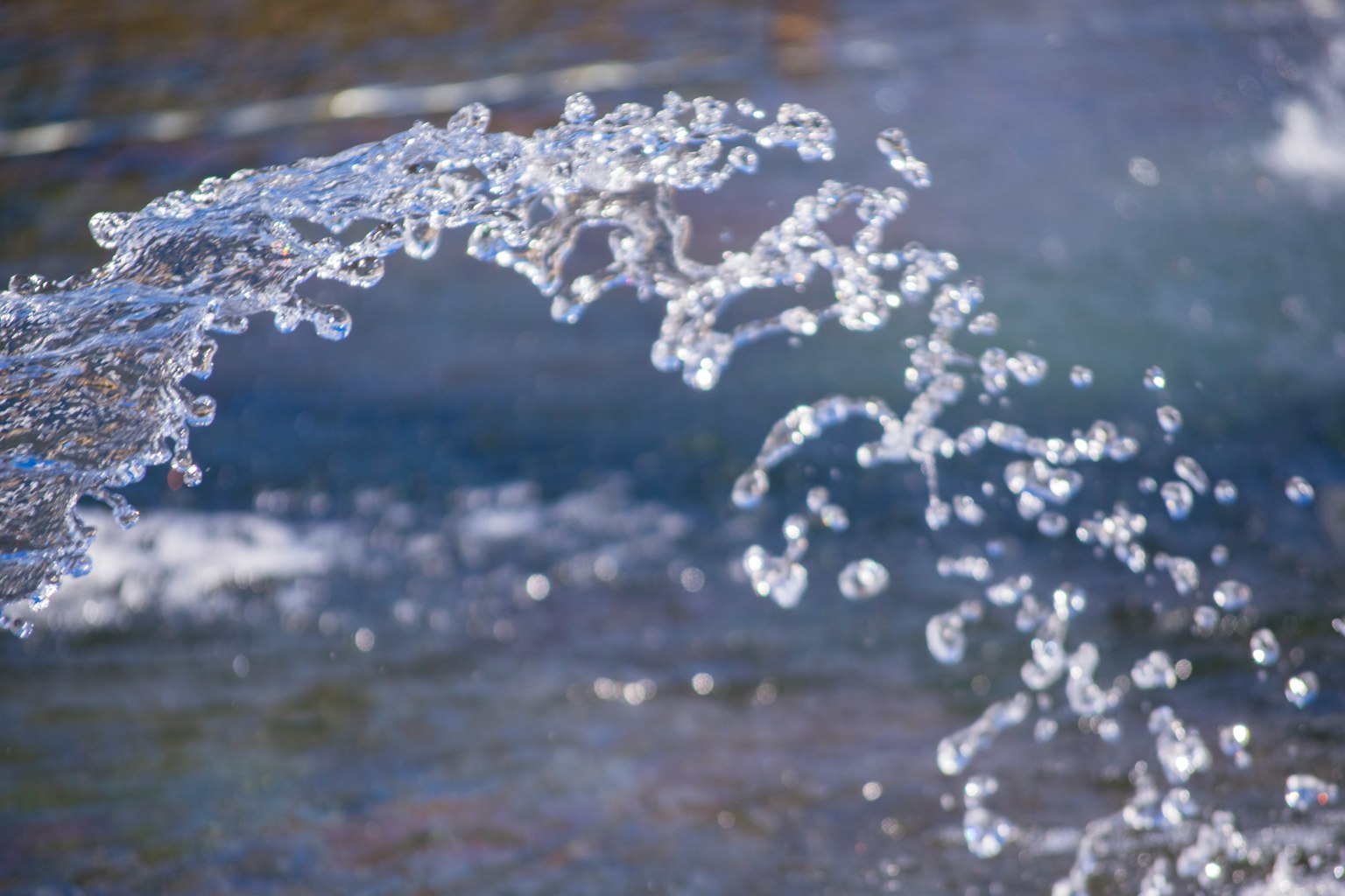 Close-up of water splash creating an arc
