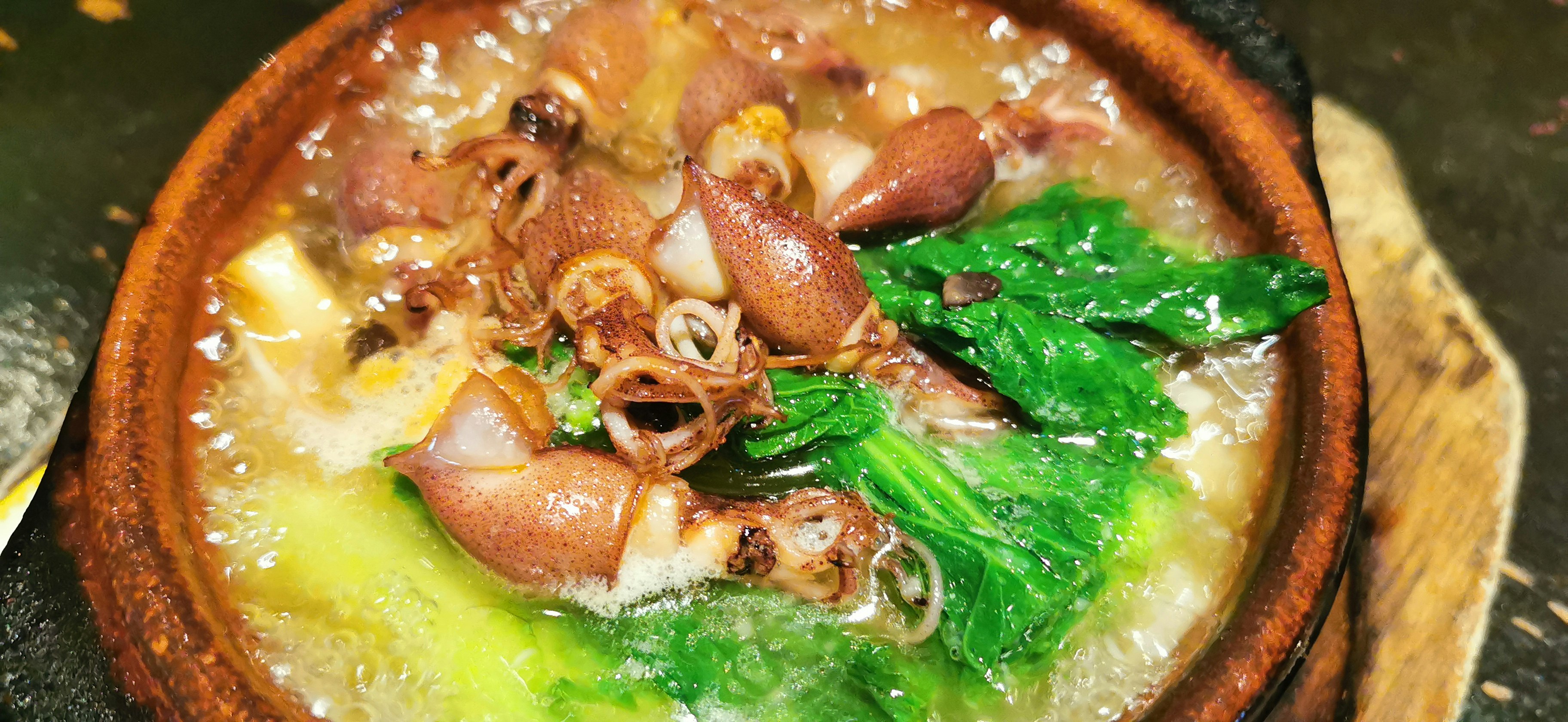Soup with clams, sausage, and spinach
