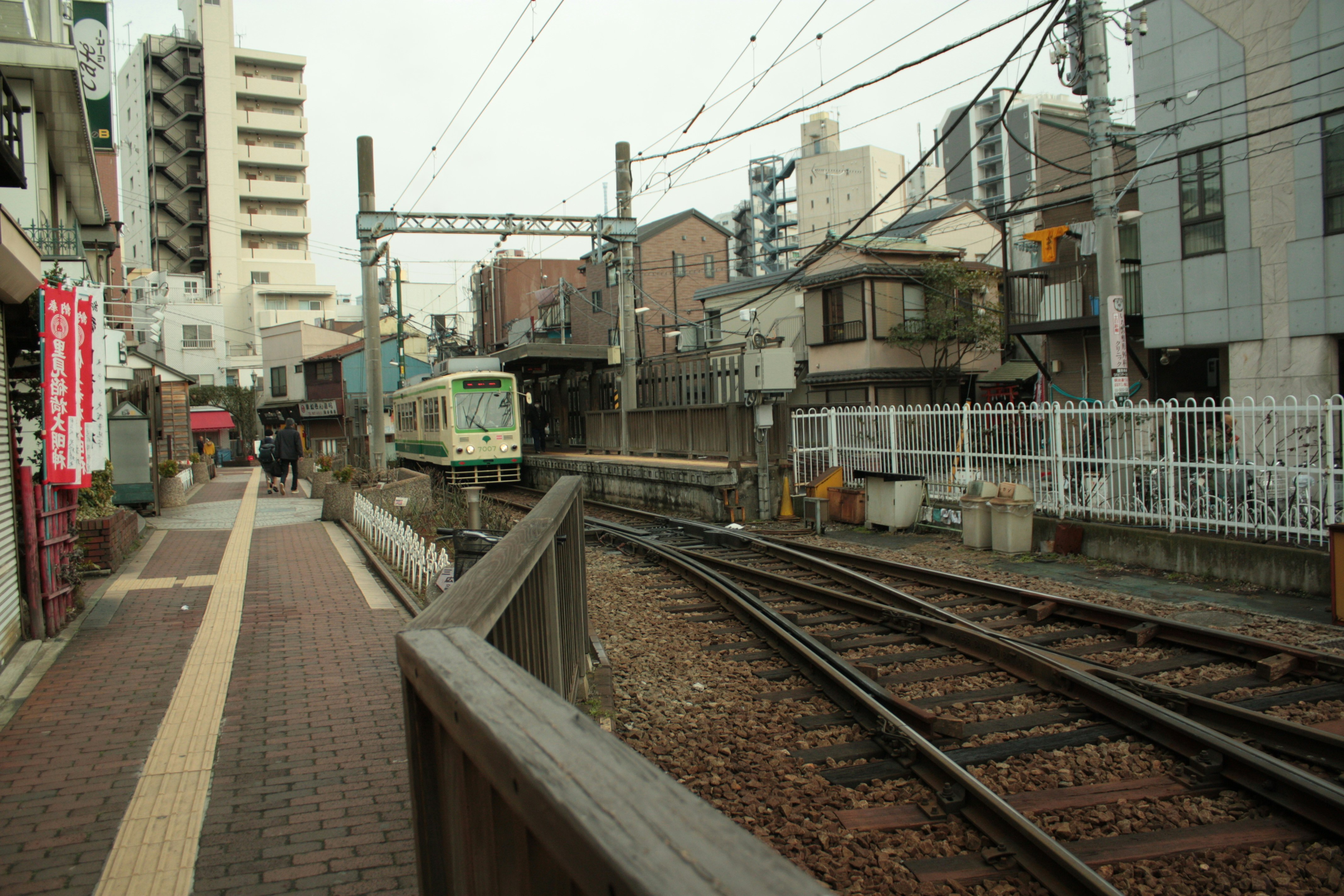 station street scene beside railway tracks