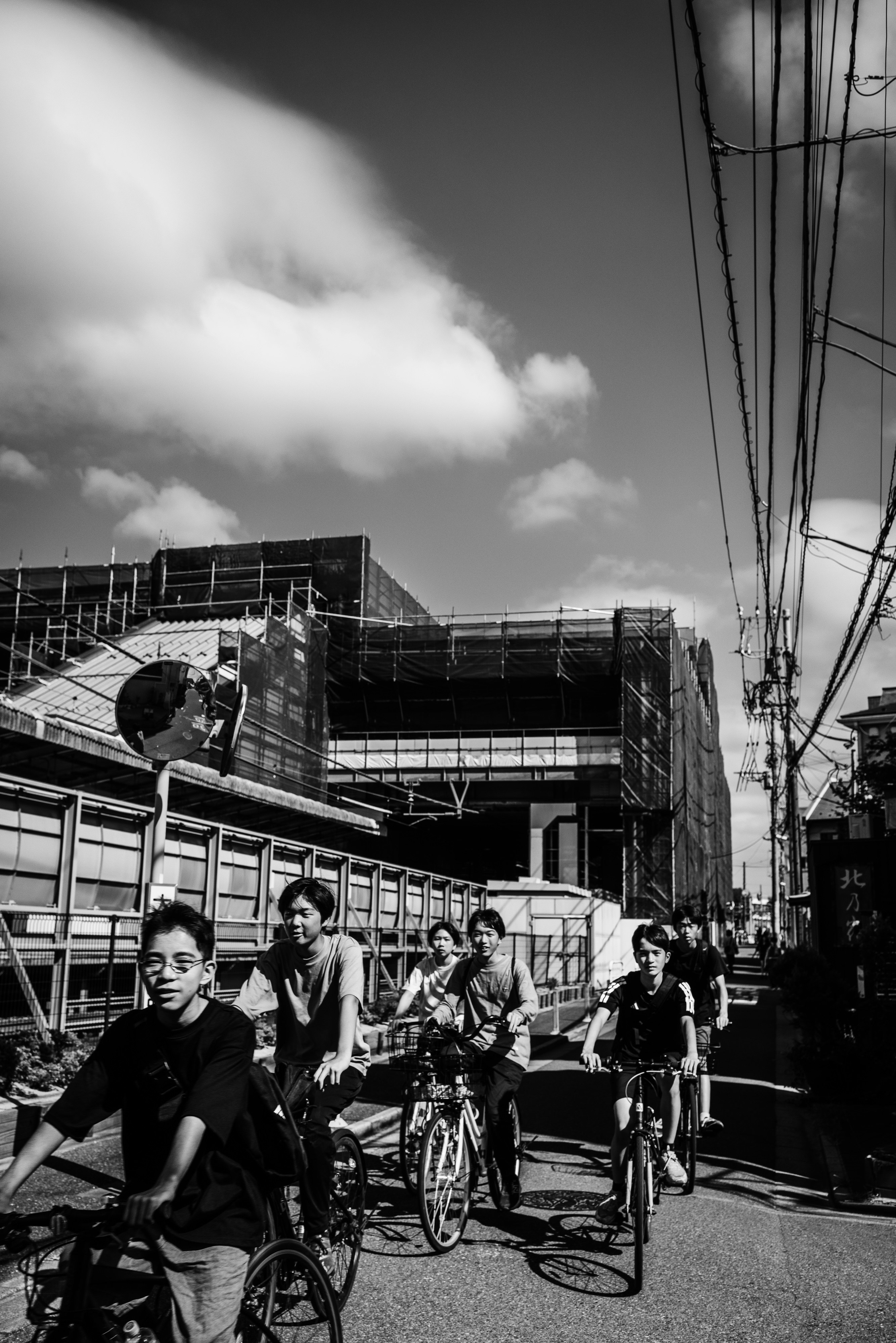 street corner with bicycles and people