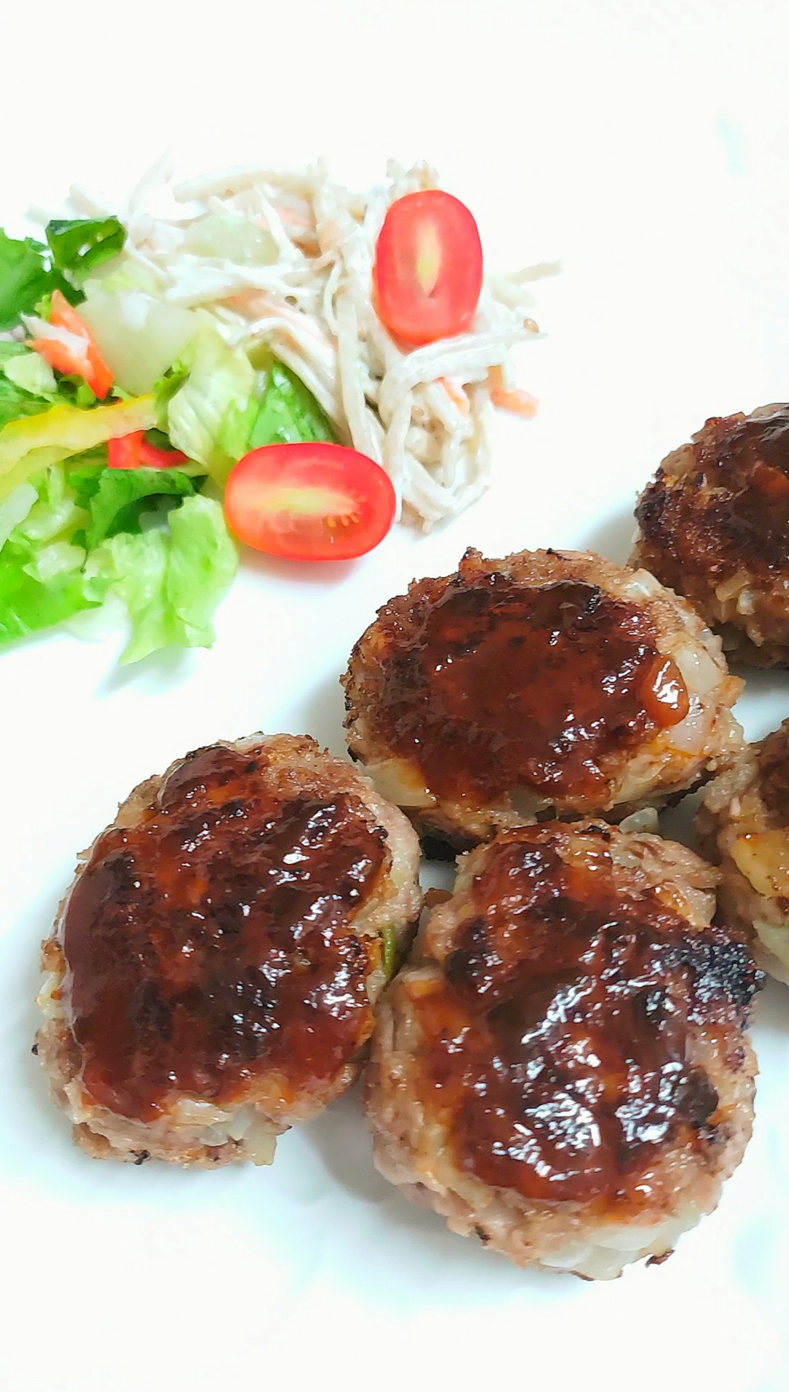 Delicious hamburger patties with a side salad