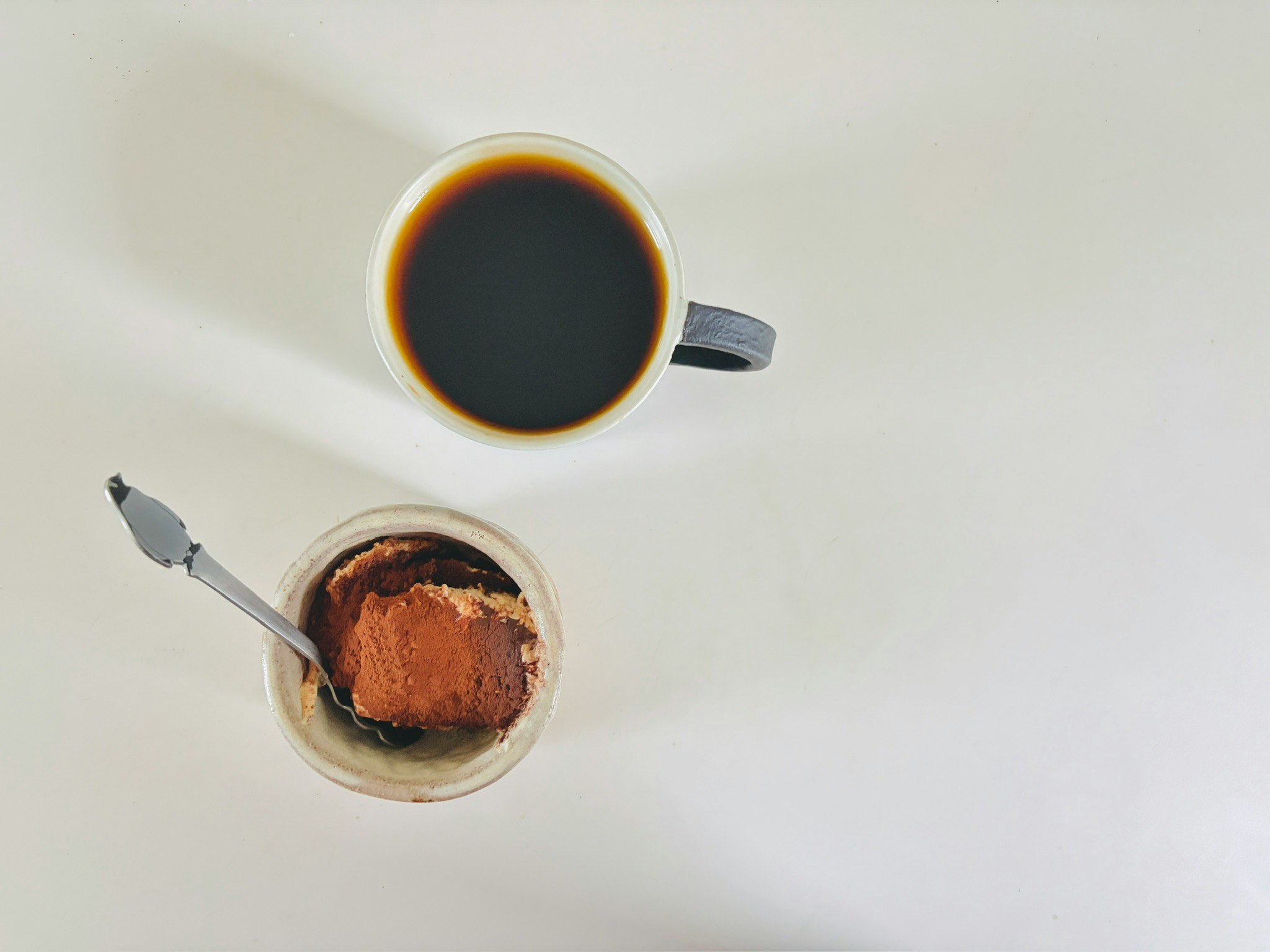 morning table with tiramisu and coffee