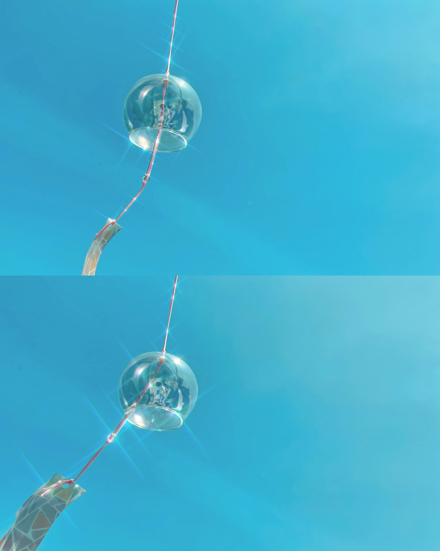 Transparente Kugelobjekt, das vor einem blauen Himmel schwebt