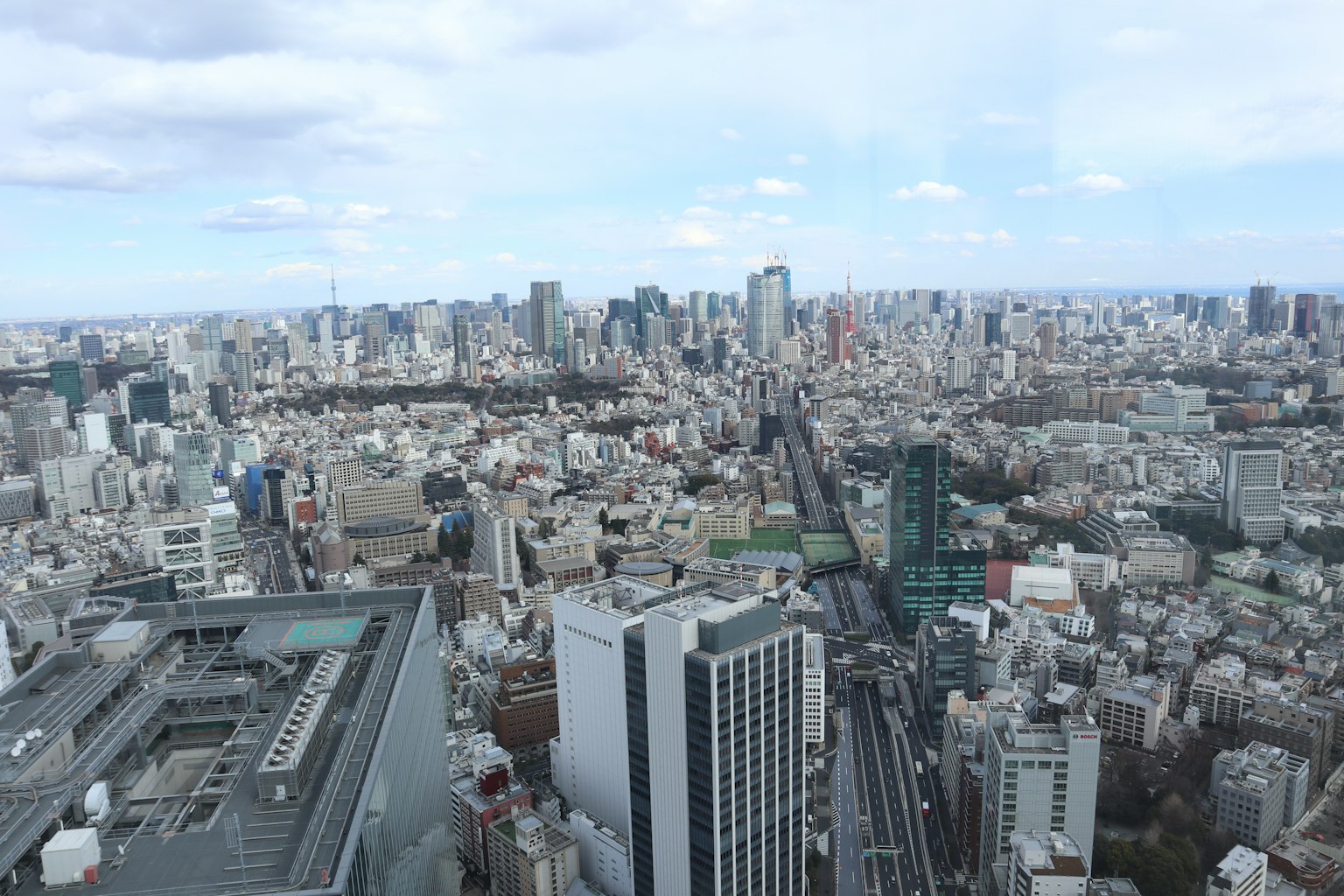 Panoramic view of Tokyo's skyline with numerous skyscrapers and urban landscape