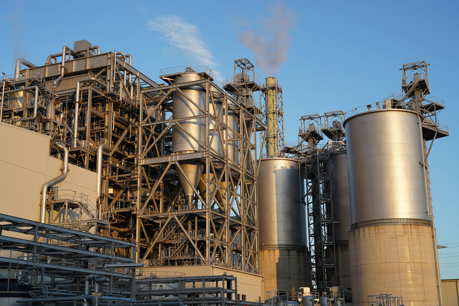 Industrial facility featuring metallic structures and silos