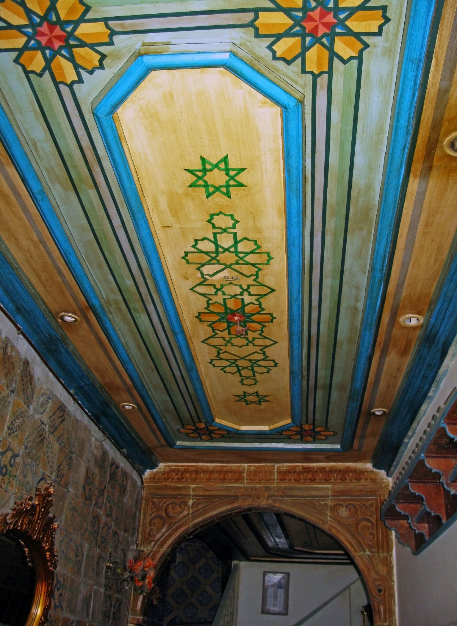 Beautifully decorated ceiling design featuring blue and gold color scheme