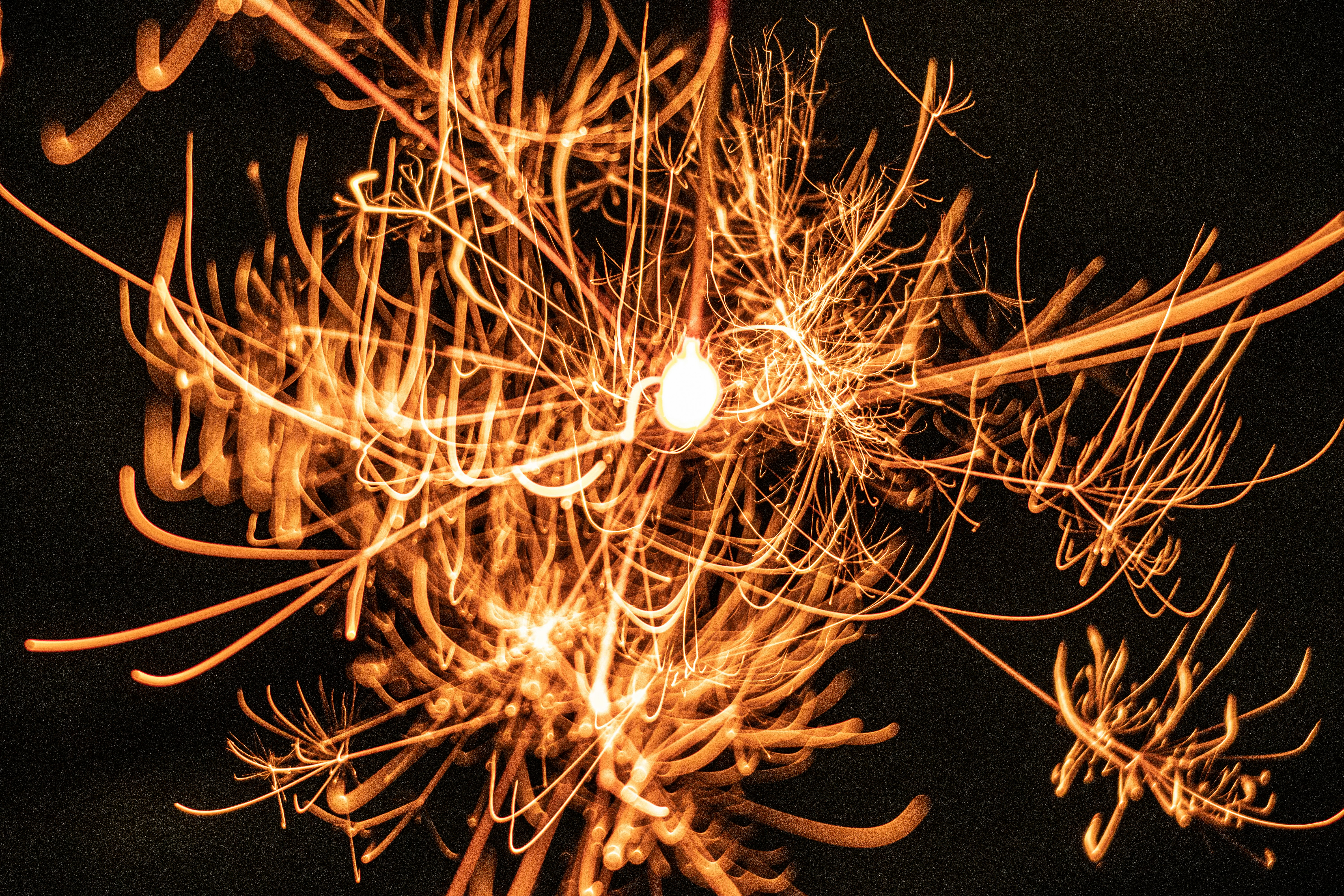 sparks bursting across a black background