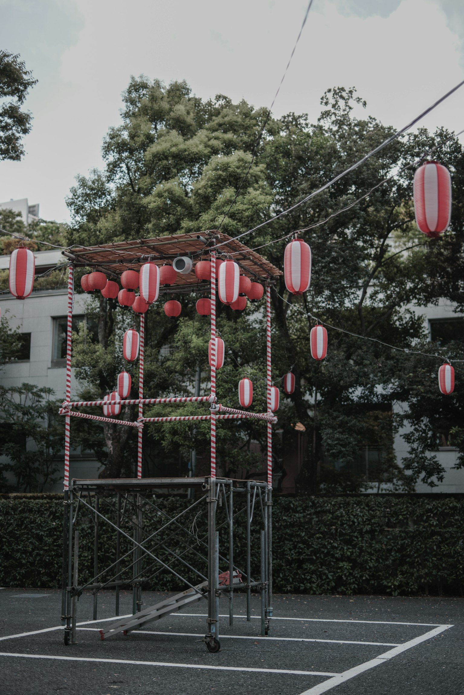 Festival structure adorned with red and white lanterns