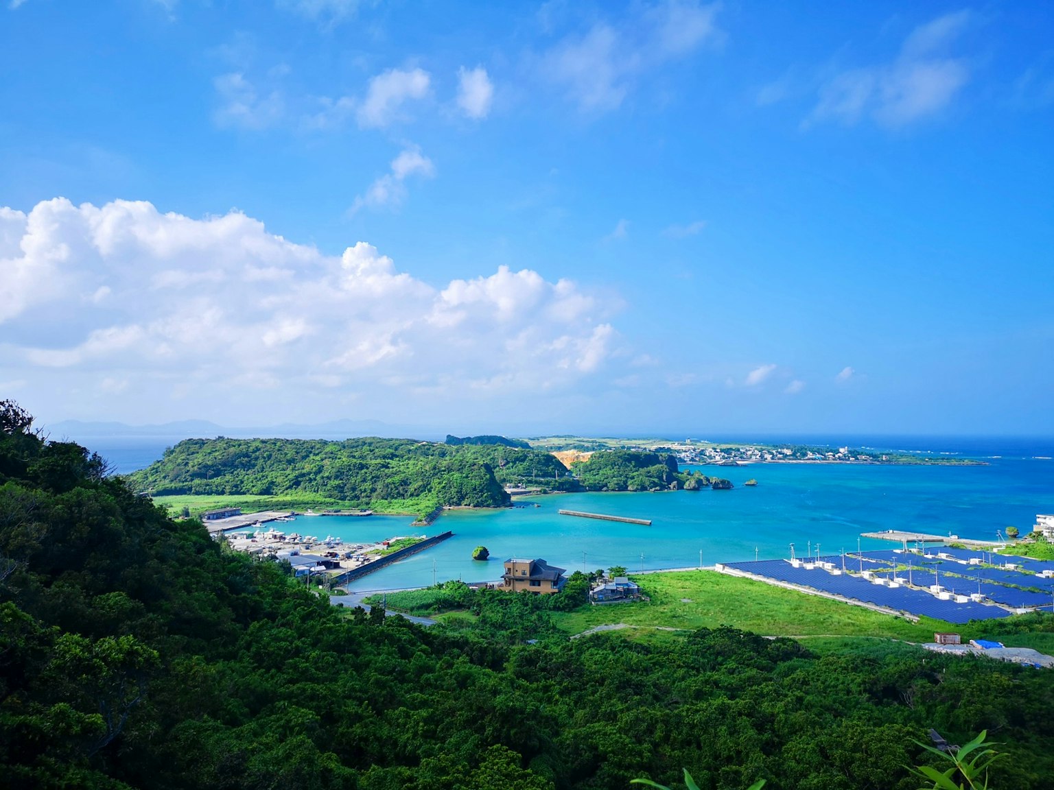 Beautiful landscape featuring a vibrant sea and lush green hills