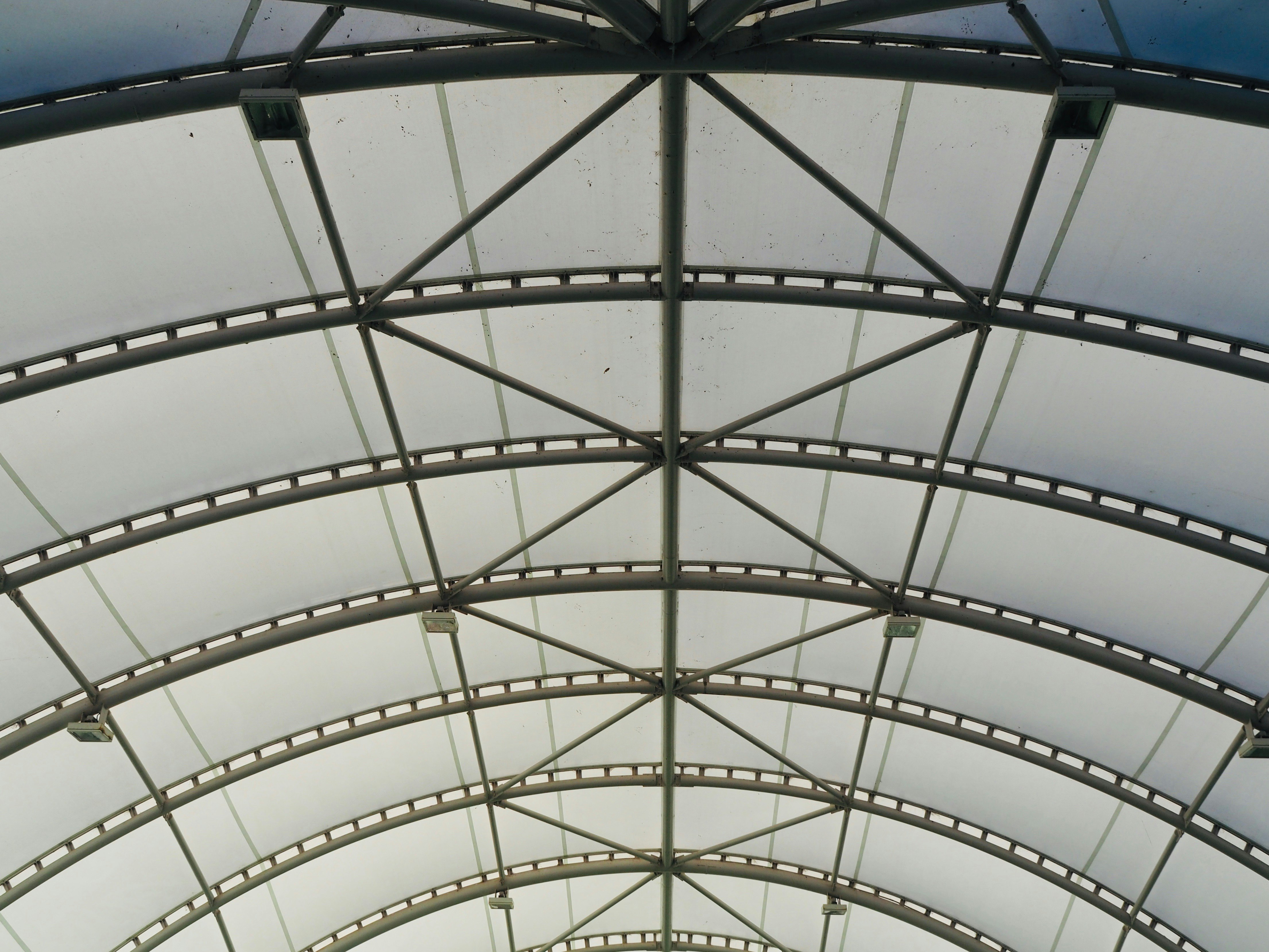 arched metal frame and transparent greenhouse roof